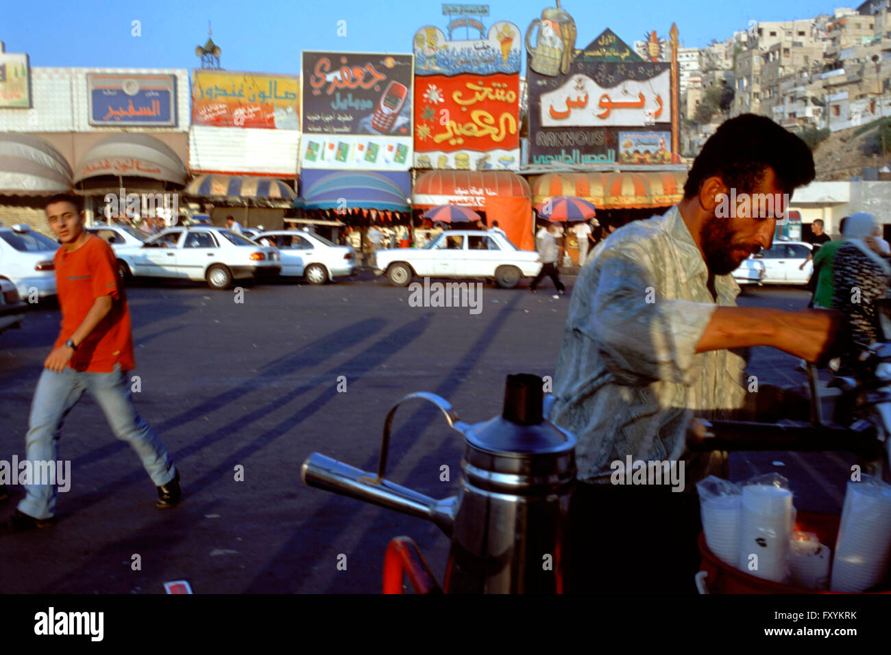Street vendor selling tea coffee at the raghadan bus station hires