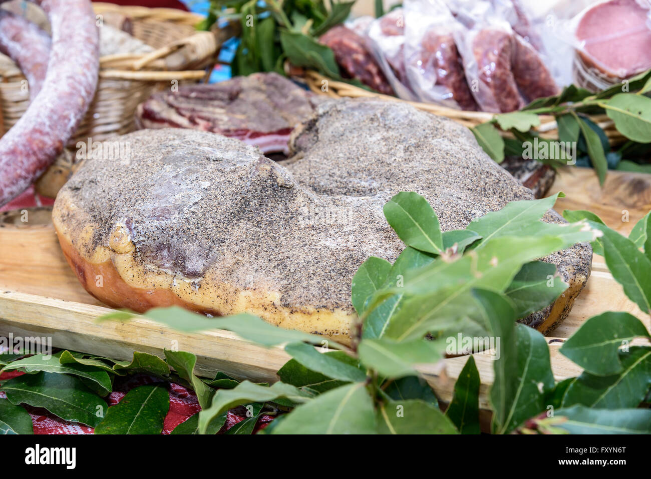 Dry cured ham naturally typical recipe of Sardinia covered with salt