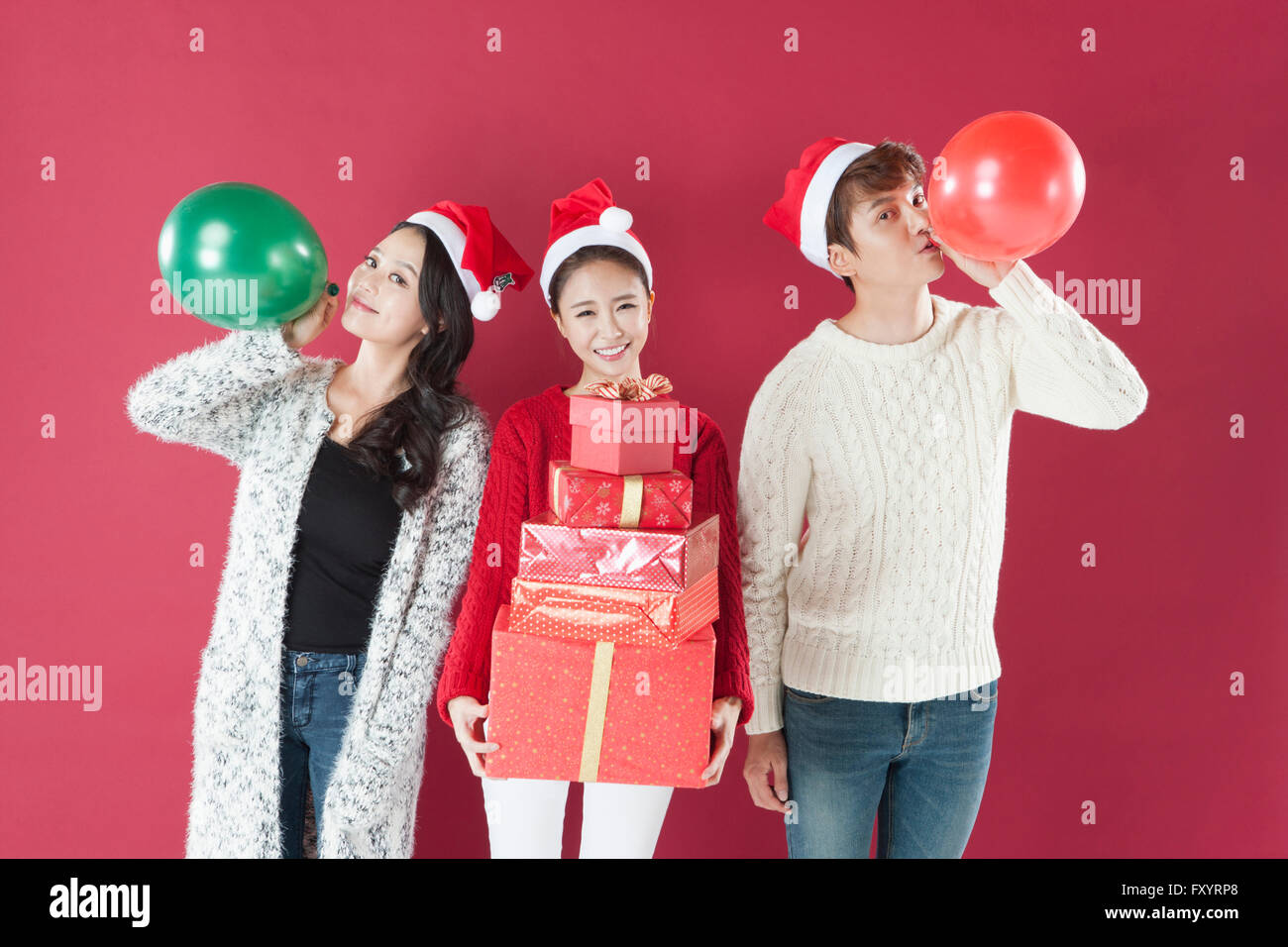 Wearing santa hats hi-res stock photography and images - Alamy