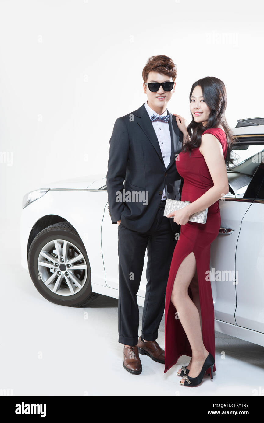 Couple Embracing By Car Stock Photo - Download Image Now - Car, Couple -  Relationship, In Front Of - iStock