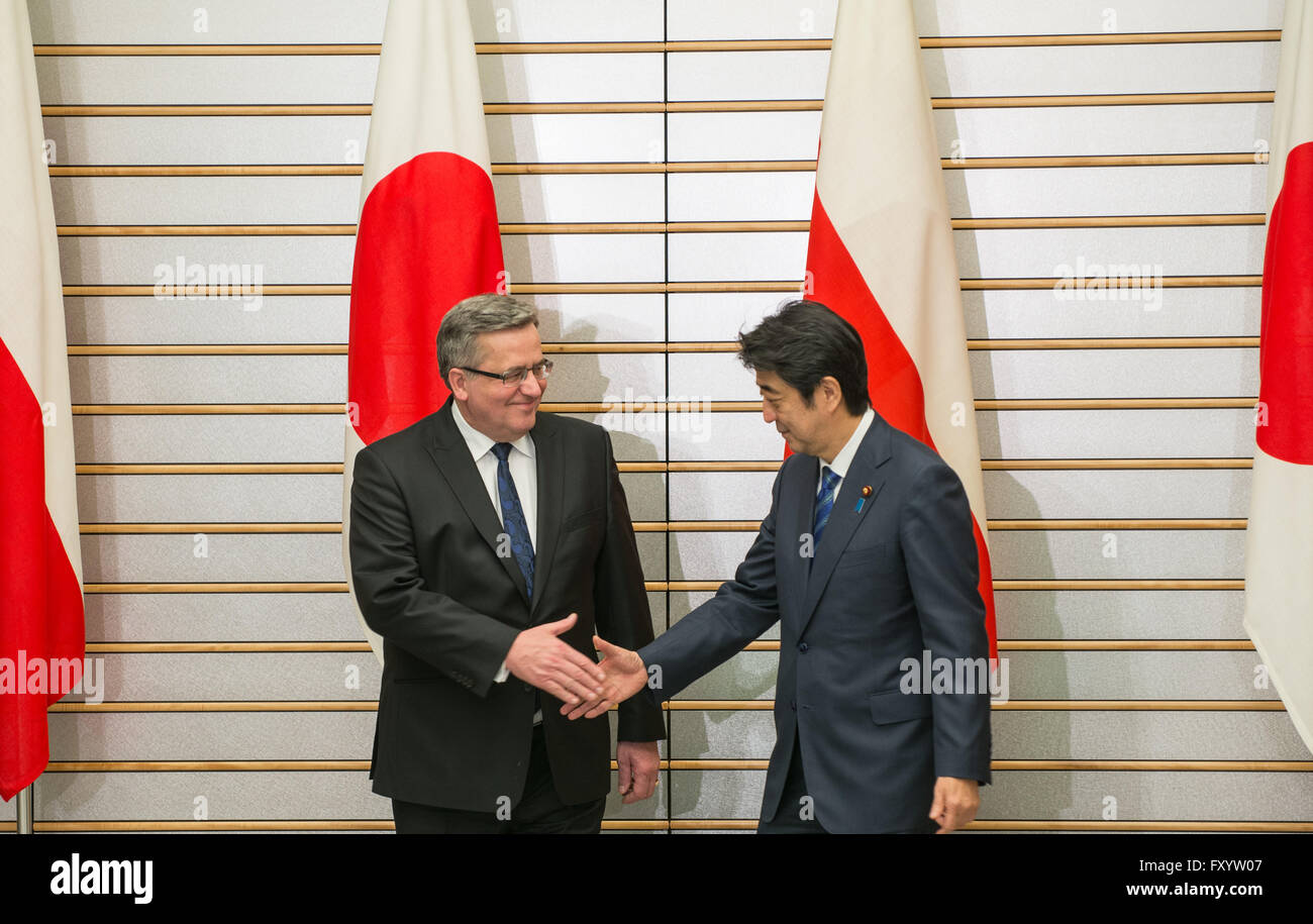 Former President of Poland Bronislaw Komorowski shakes hand with Prime Minister of Japan Shinzo Abe in Tokyo in February, 2015 Stock Photo