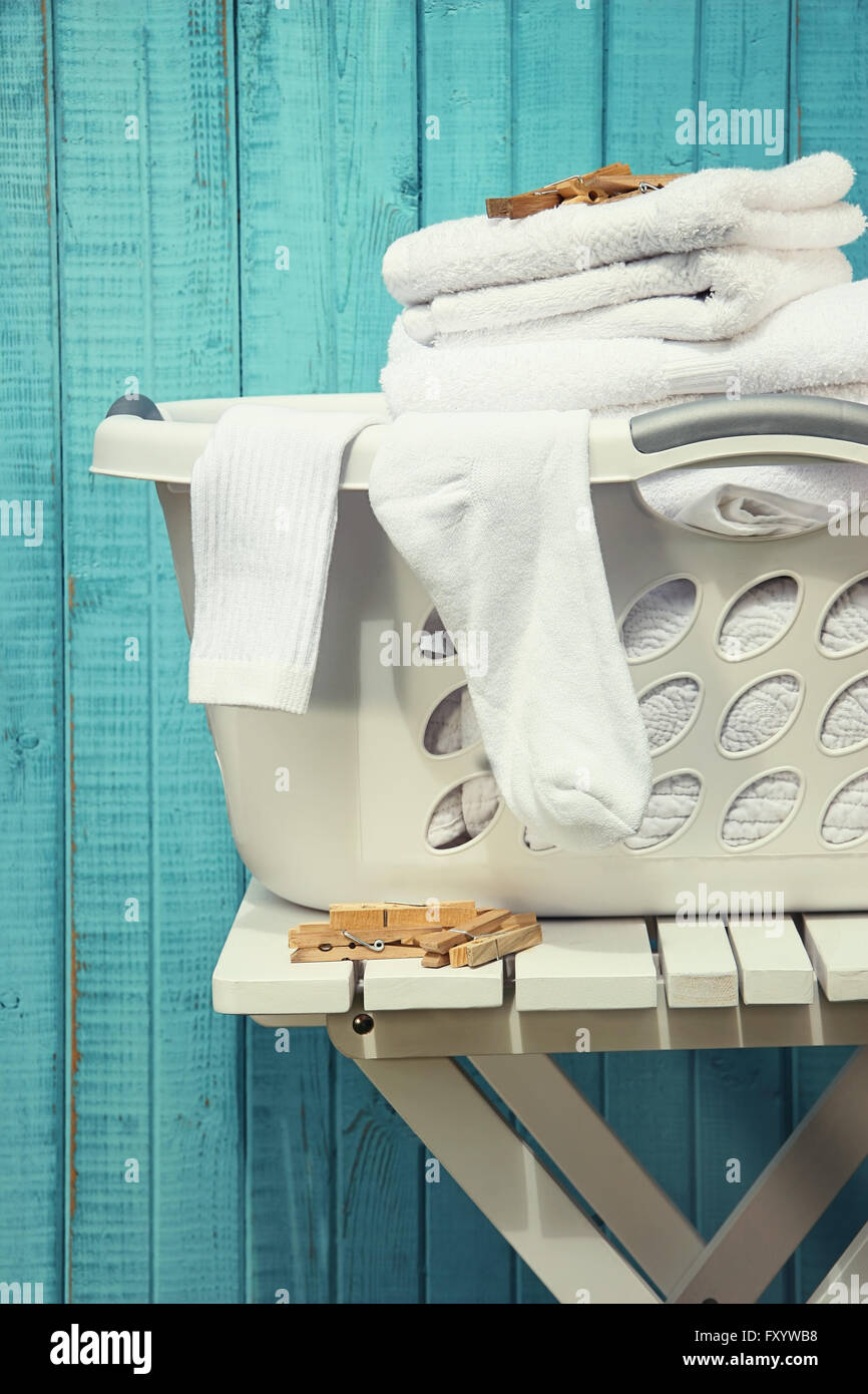 Laundry basket with towels and socks Stock Photo Alamy