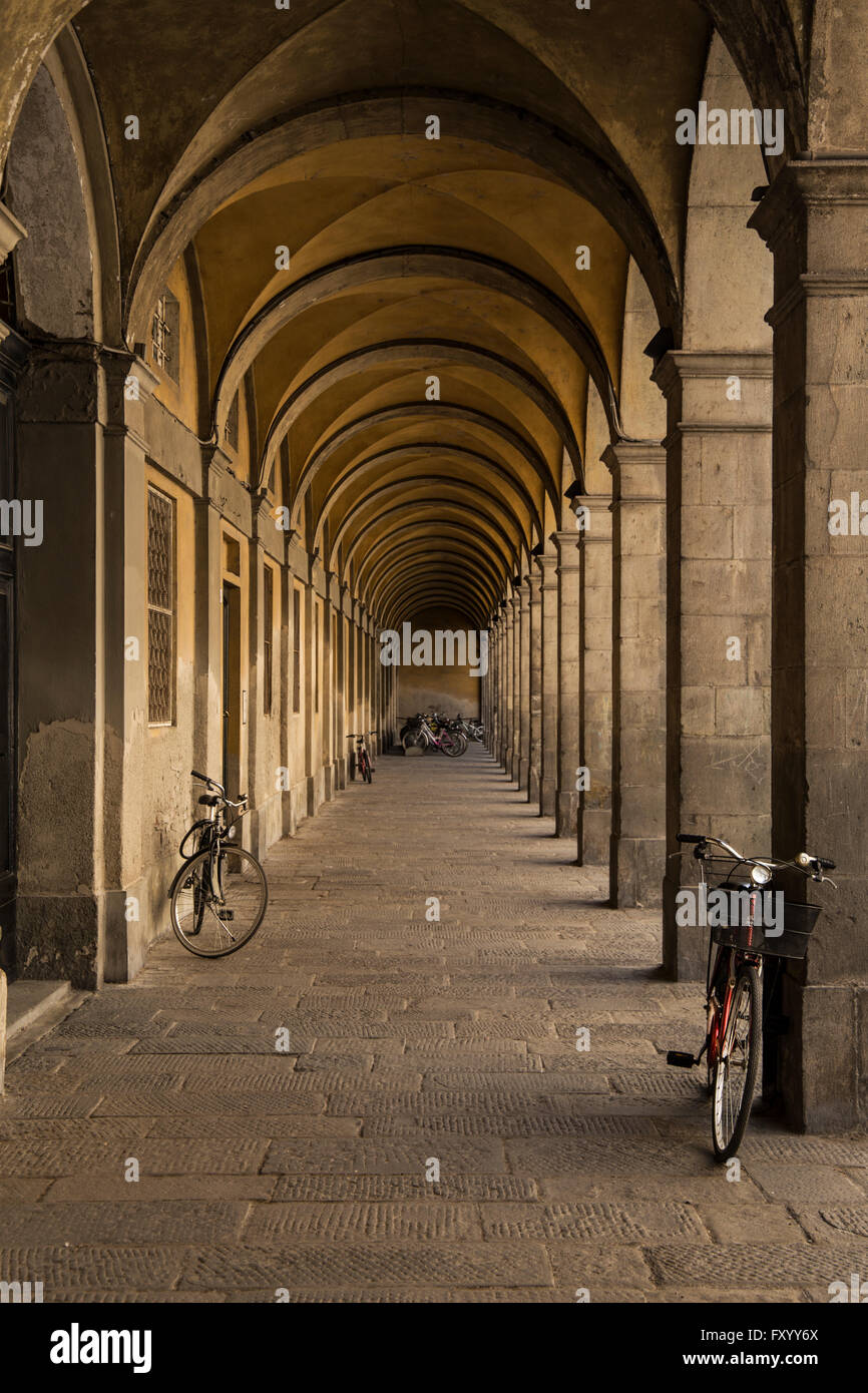 A Street View Under Archways in Lucca, Tuscany Stock Photo