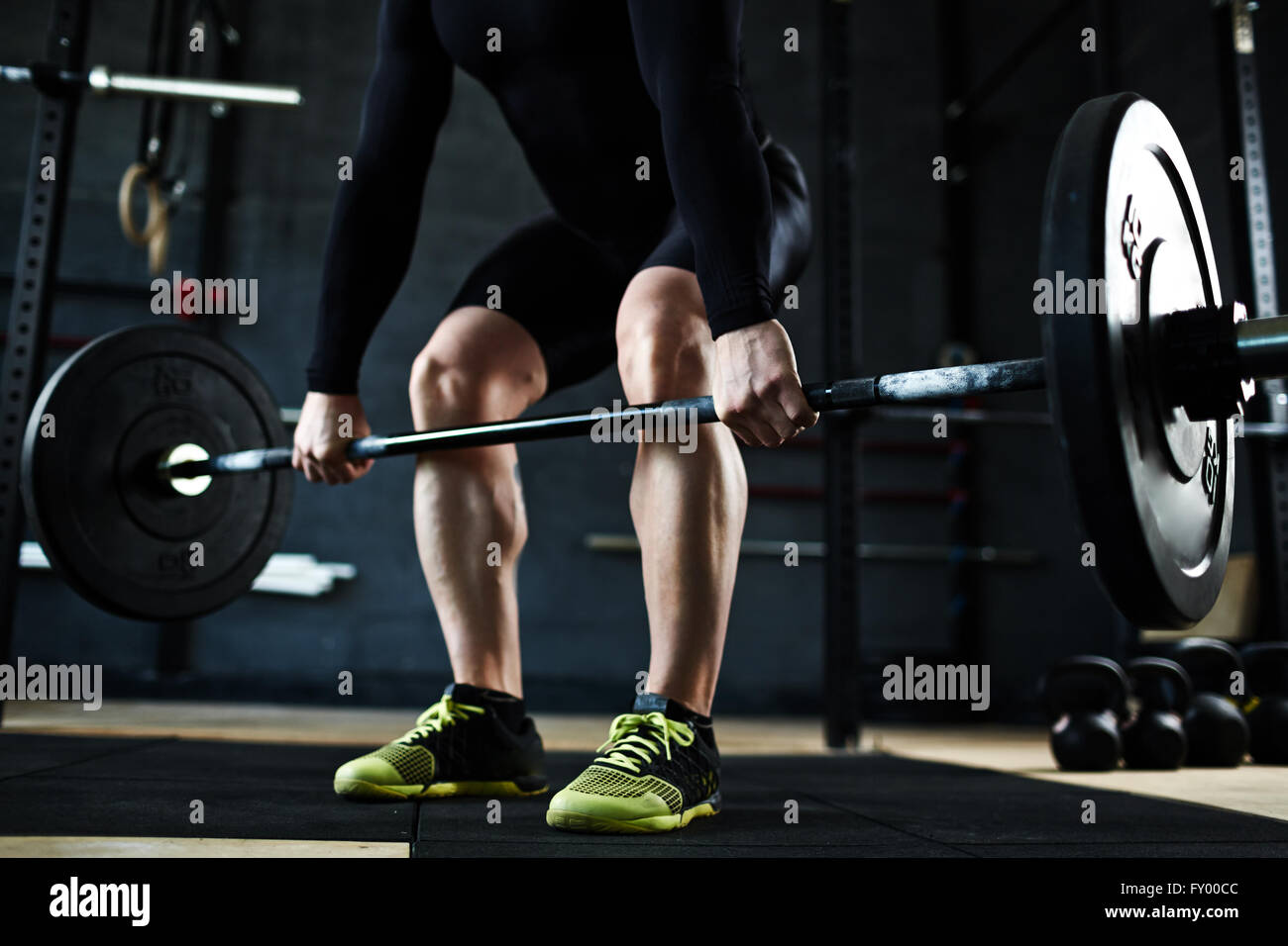 Lifting barbell in gym Stock Photo Alamy