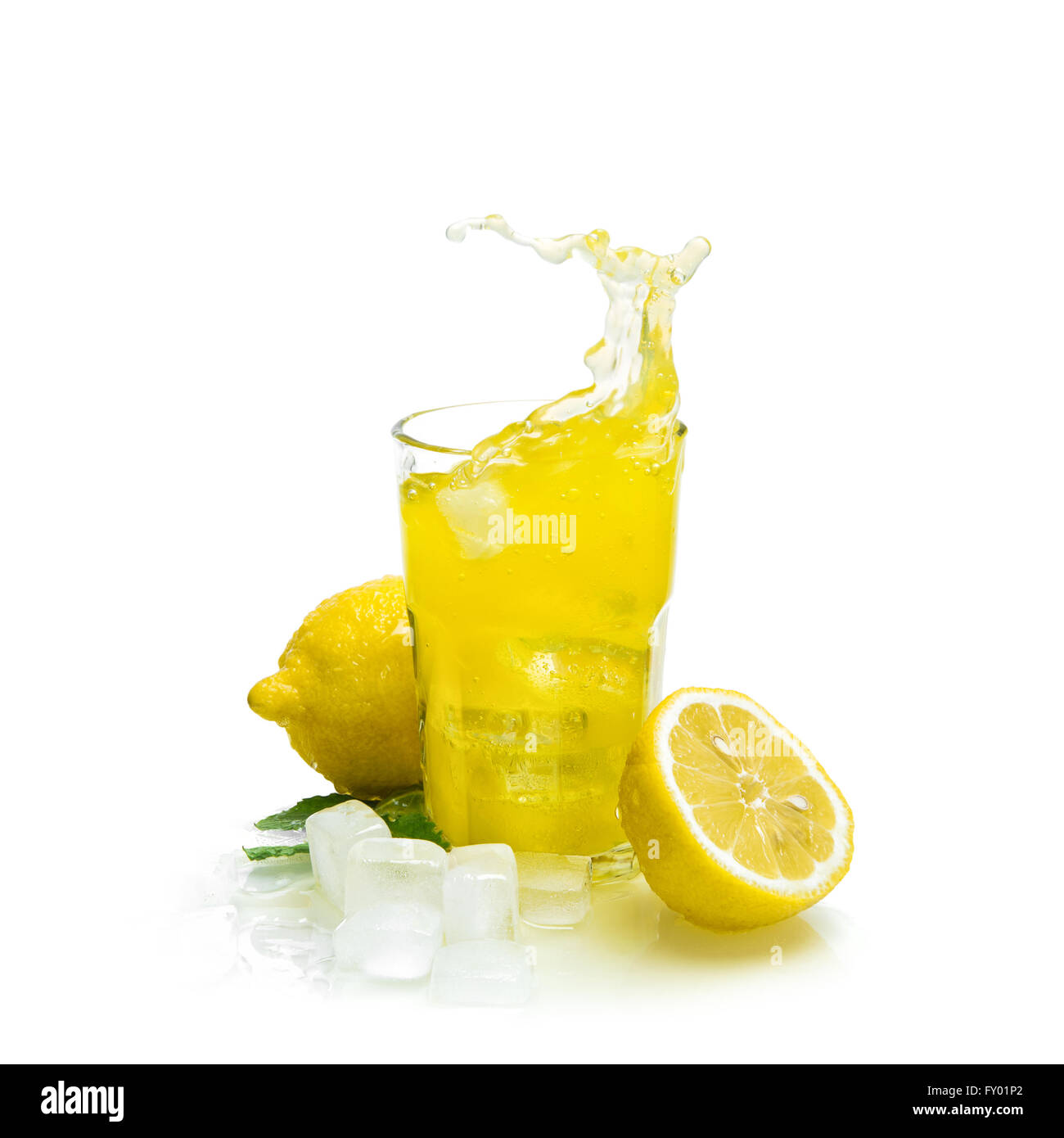 Lemon drink with ice on white background. Fruit cocktail splash Stock Photo