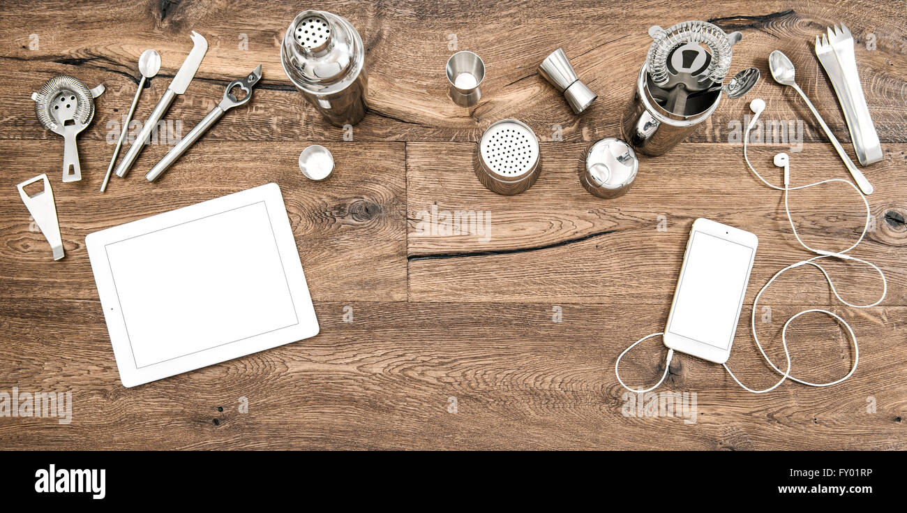 Bar counter with tools, accessories and electronic devices. Flat lay background Stock Photo
