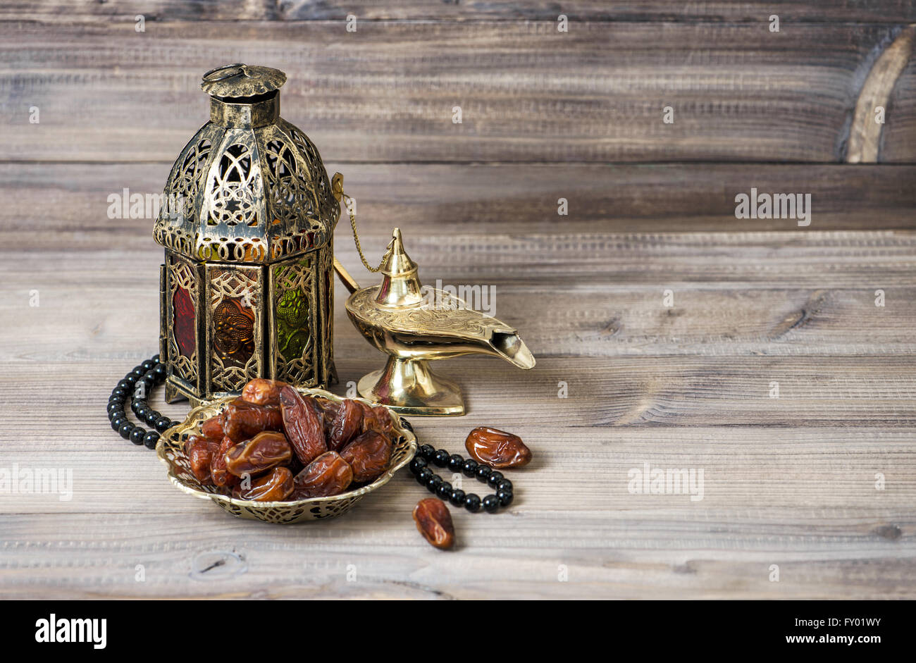 Islamic holidays decoration. Arabian lantern, dates and rosary. Ramadan kareem Stock Photo