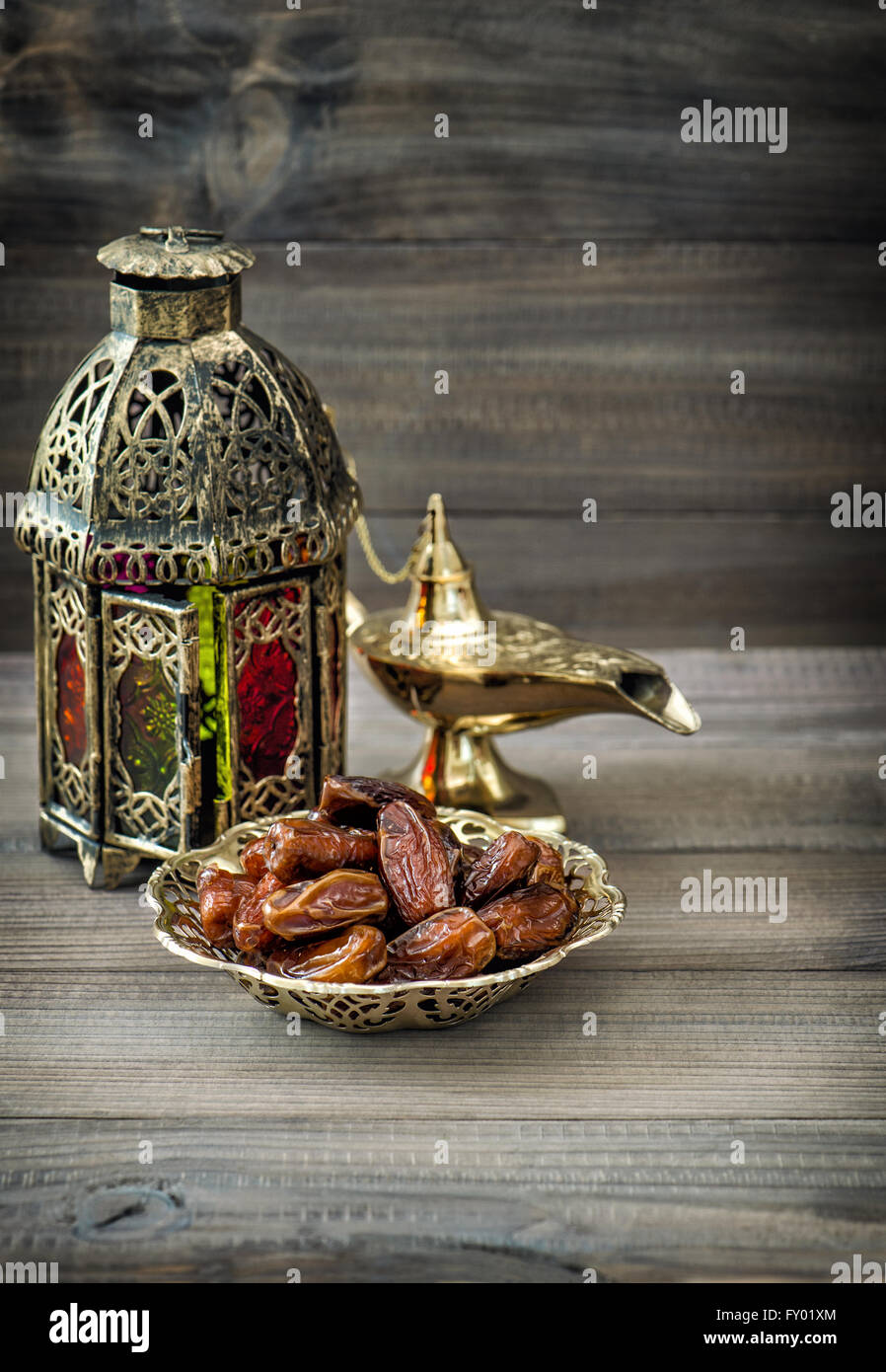 Arabian lantern, golden lamp, fruits. Vintage style toned picture Stock Photo