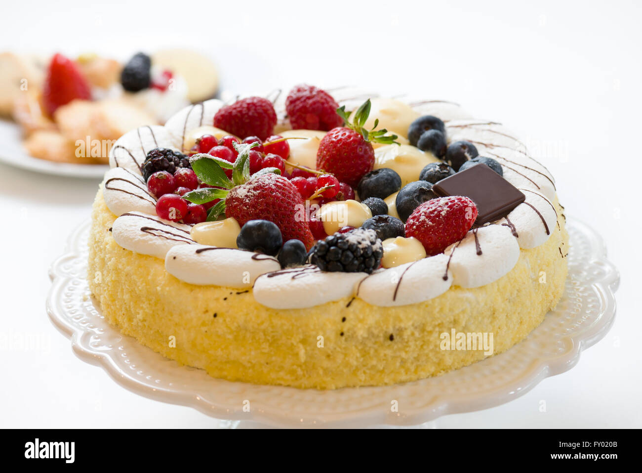 cake pastry decorated with fresh fruits and cream Stock Photo Alamy