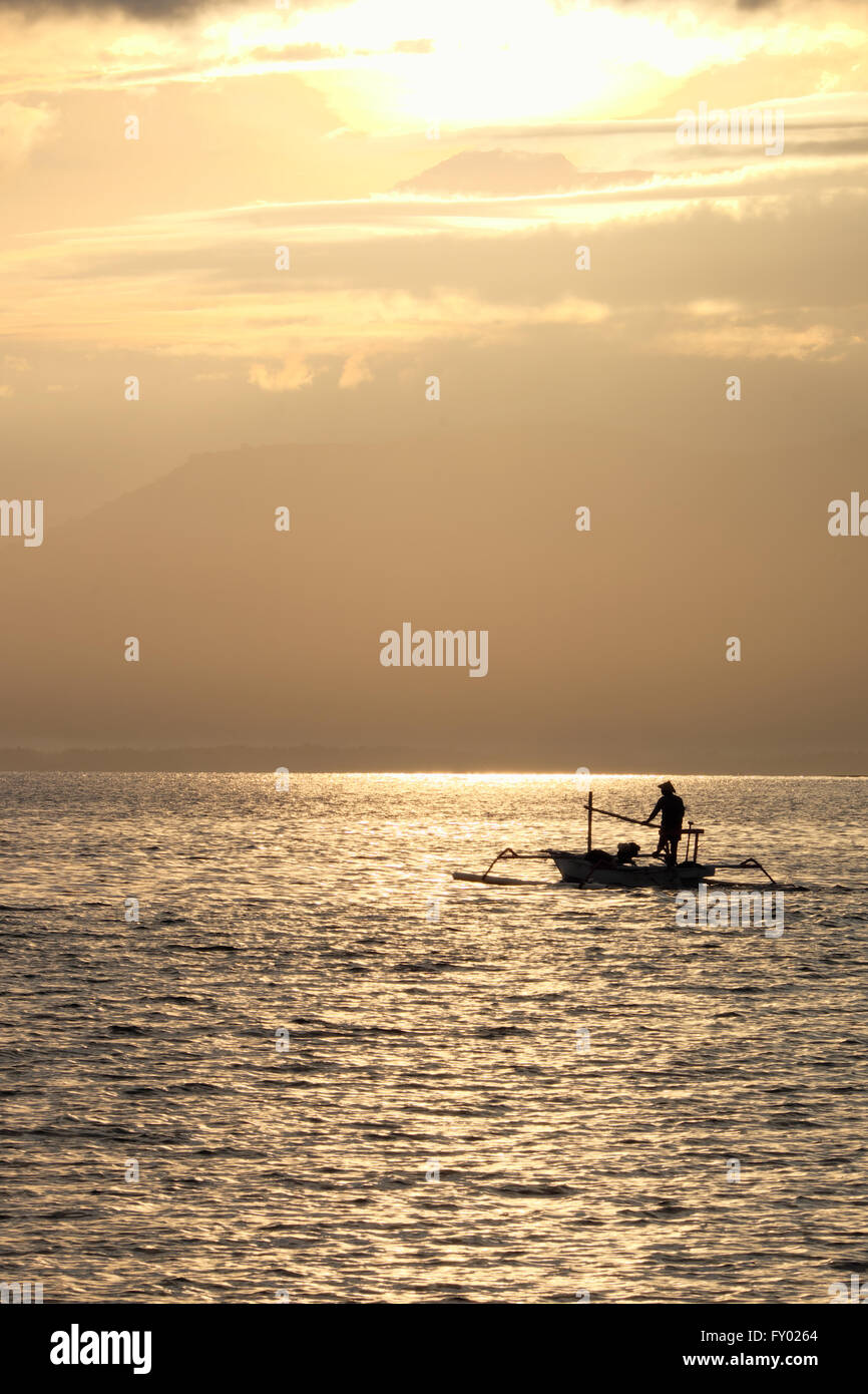 Fisherman in the morning near Rinjani volcano, lombok, indonesia Stock Photo