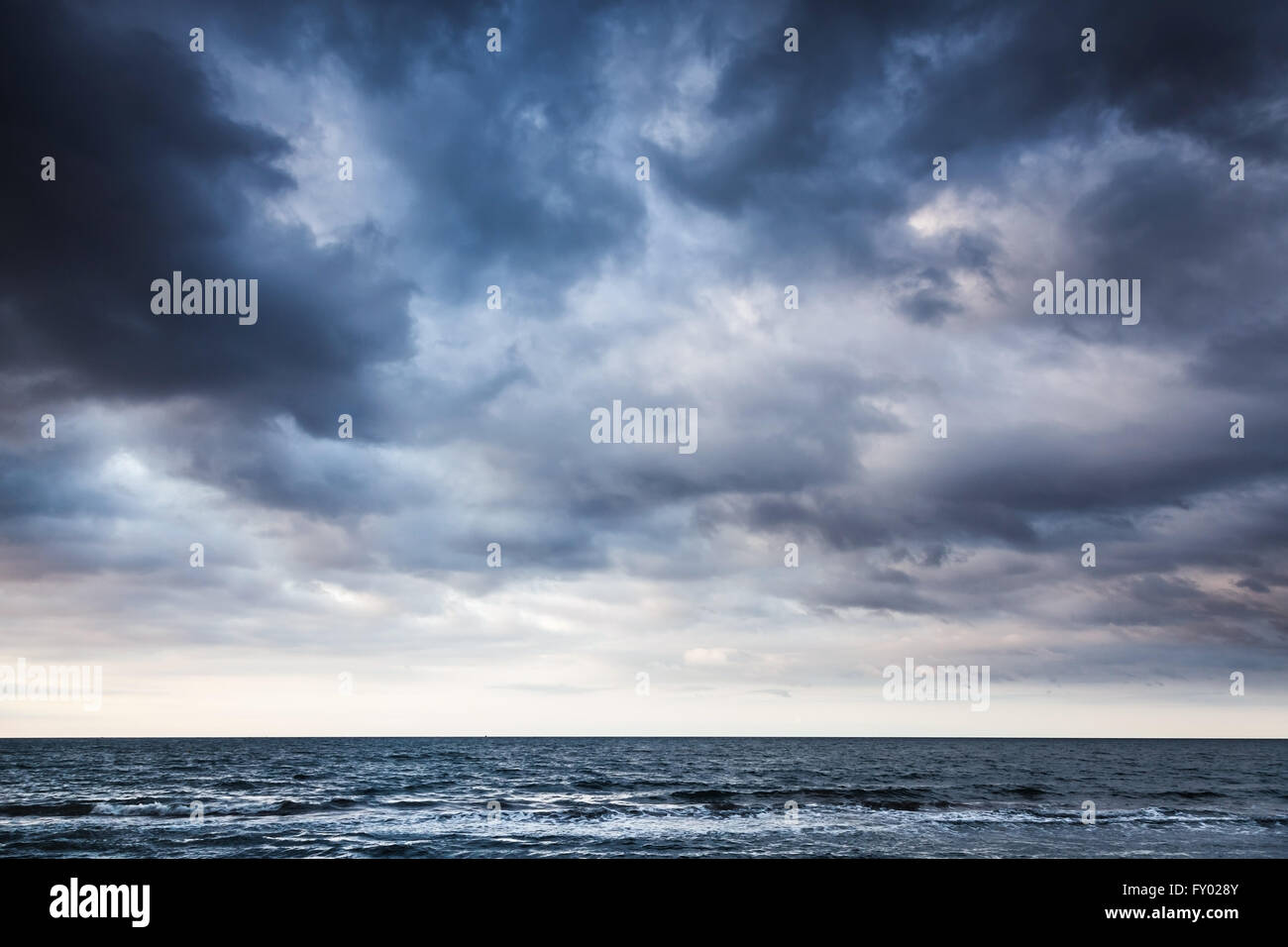 Dramatic stormy dark cloudy sky over sea, natural photo background ...