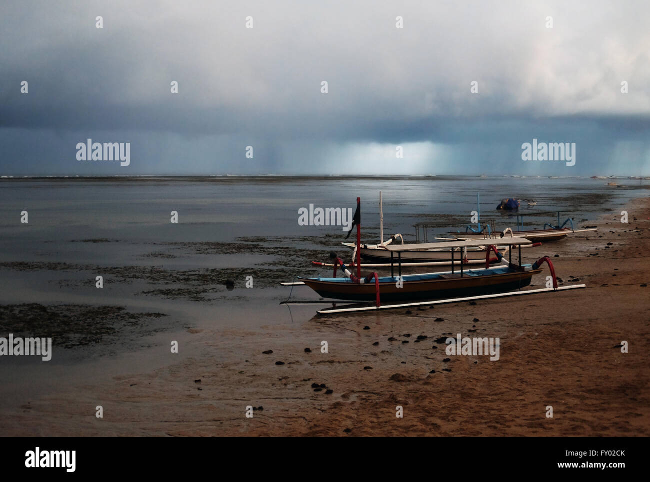 Boat at night with scary dramatical stormy clouds in the background Stock Photo