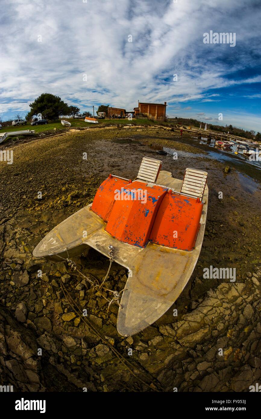 Abandoned pedalo-boat ashore Kuje bay in Istria Croatia Stock Photo