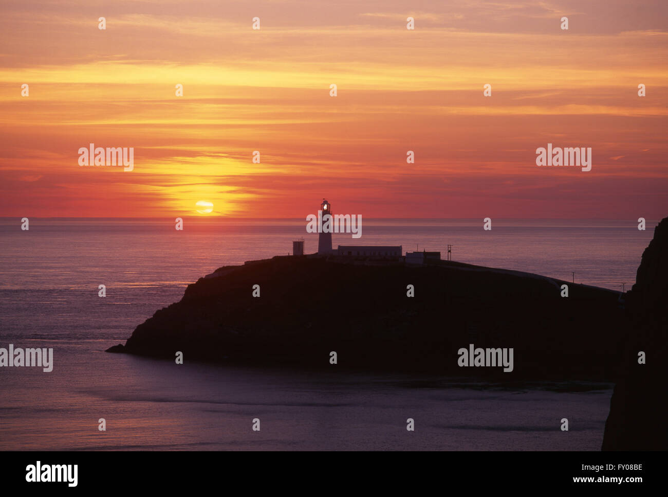 South Stack lighthouse at sunset Near Holyhead Anglesey North Wales UK Stock Photo