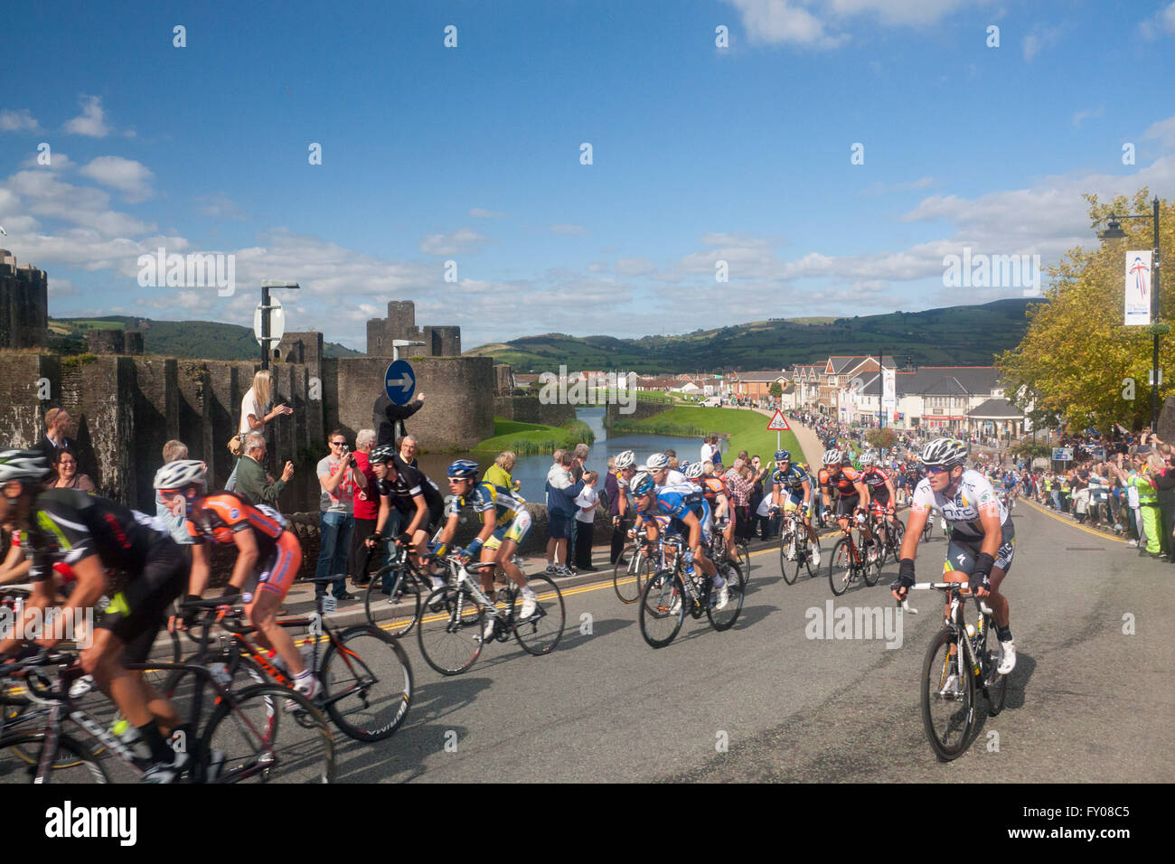 Tour of Britain 2011 riders passing Caerphilly Castle South Wales UK Stock Photo