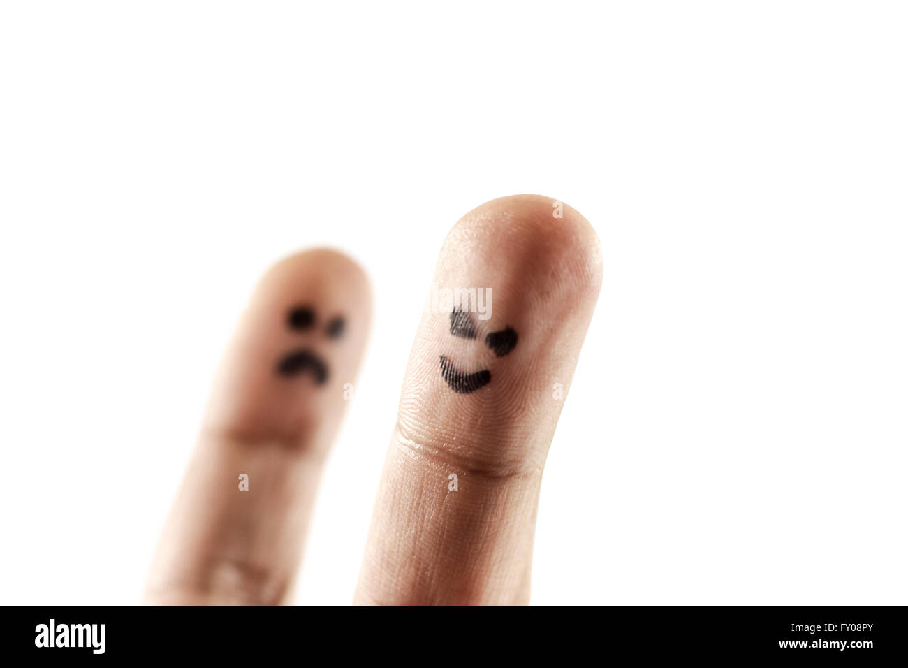 White background with two fingers representing sadness and happiness Stock Photo