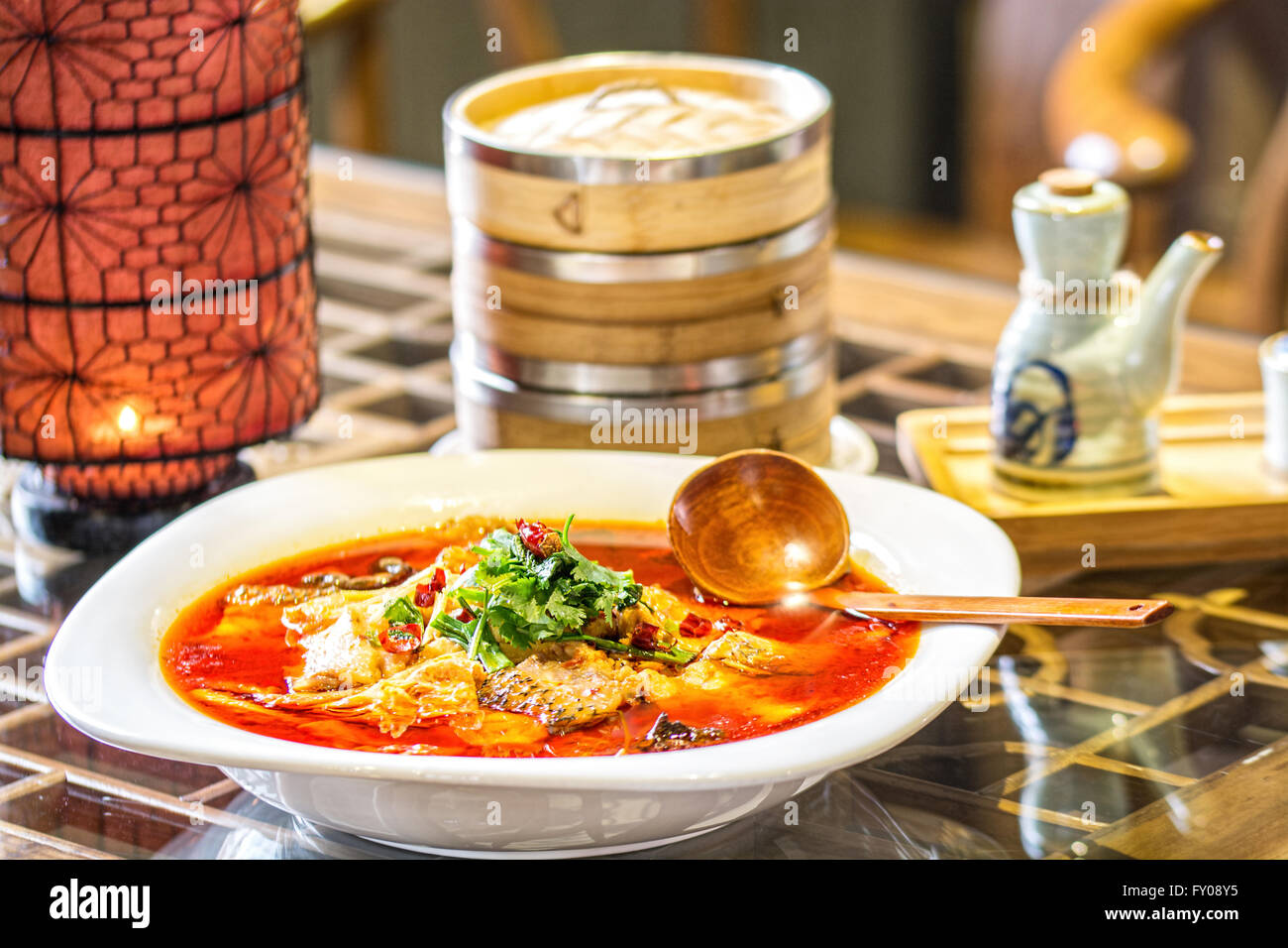 chinese fish splinters broth in chinese ambient Stock Photo Alamy