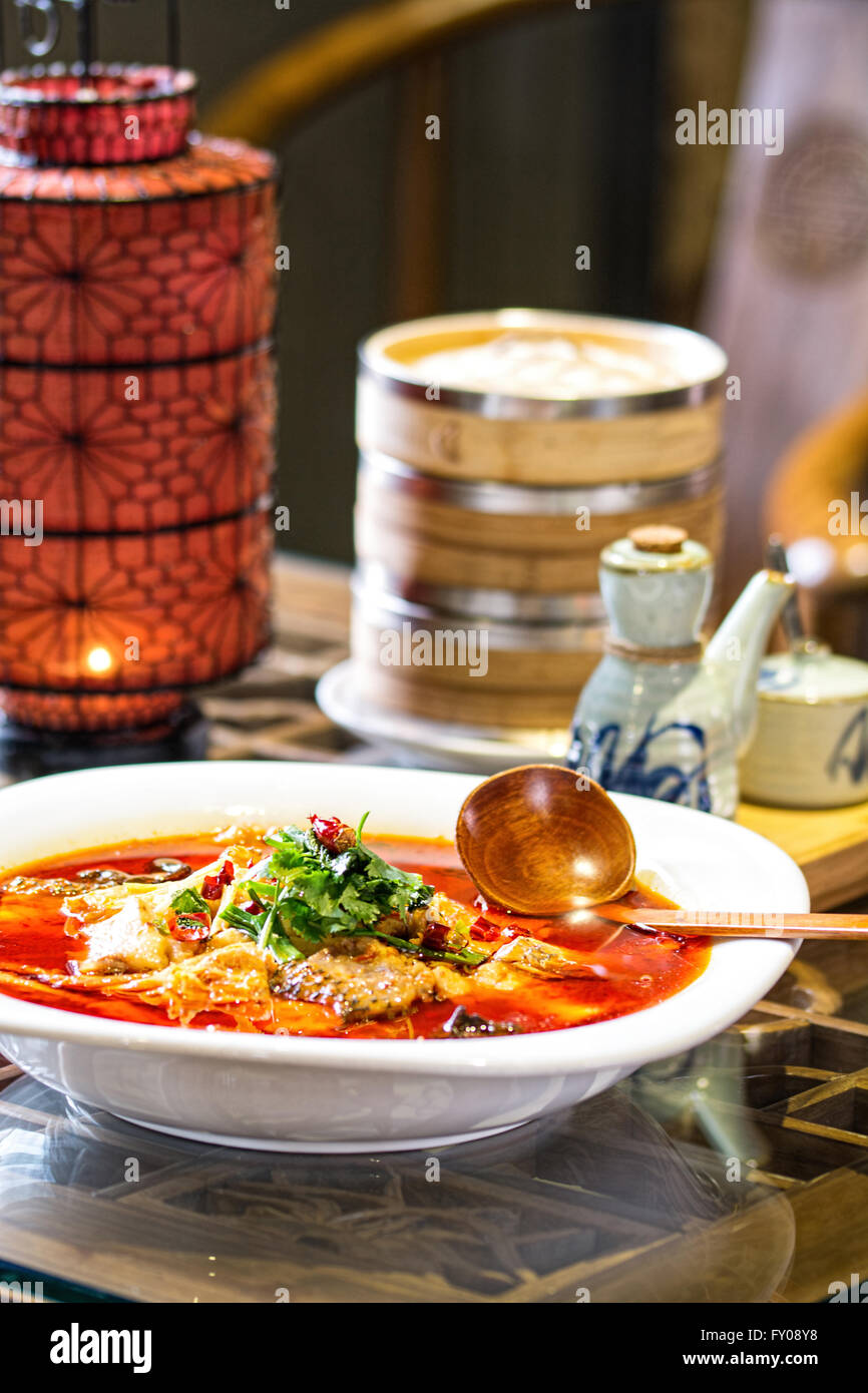 chinese fish splinters broth in chinese ambient Stock Photo Alamy