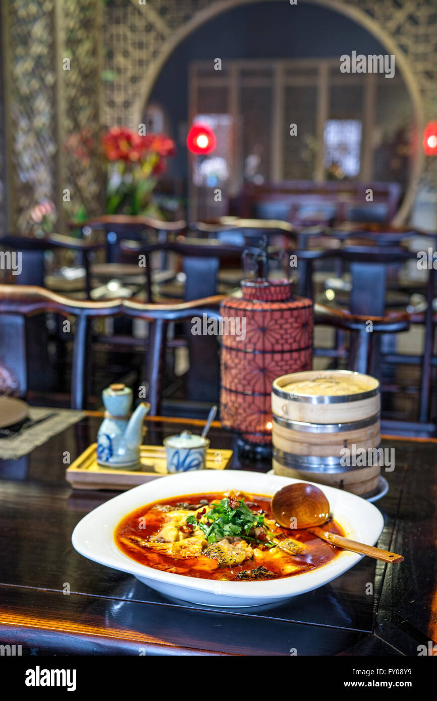 chinese fish splinters broth in chinese ambient Stock Photo - Alamy