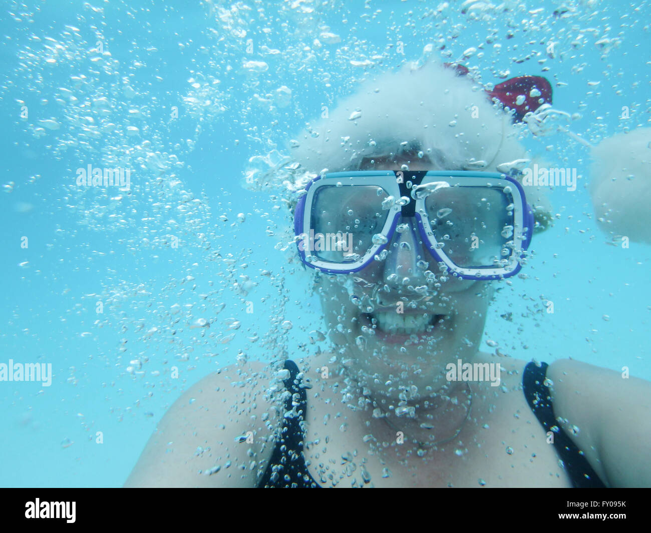 Mature stocking free Mature Woman Wearing Red Christmas Stocking Cap Underwater Surrounded By Bubbles Stock Photo Alamy
