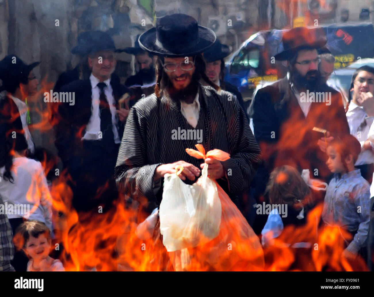 Orthodox ( Hasidic ) boys and men burn the Chametz (leavened foods that