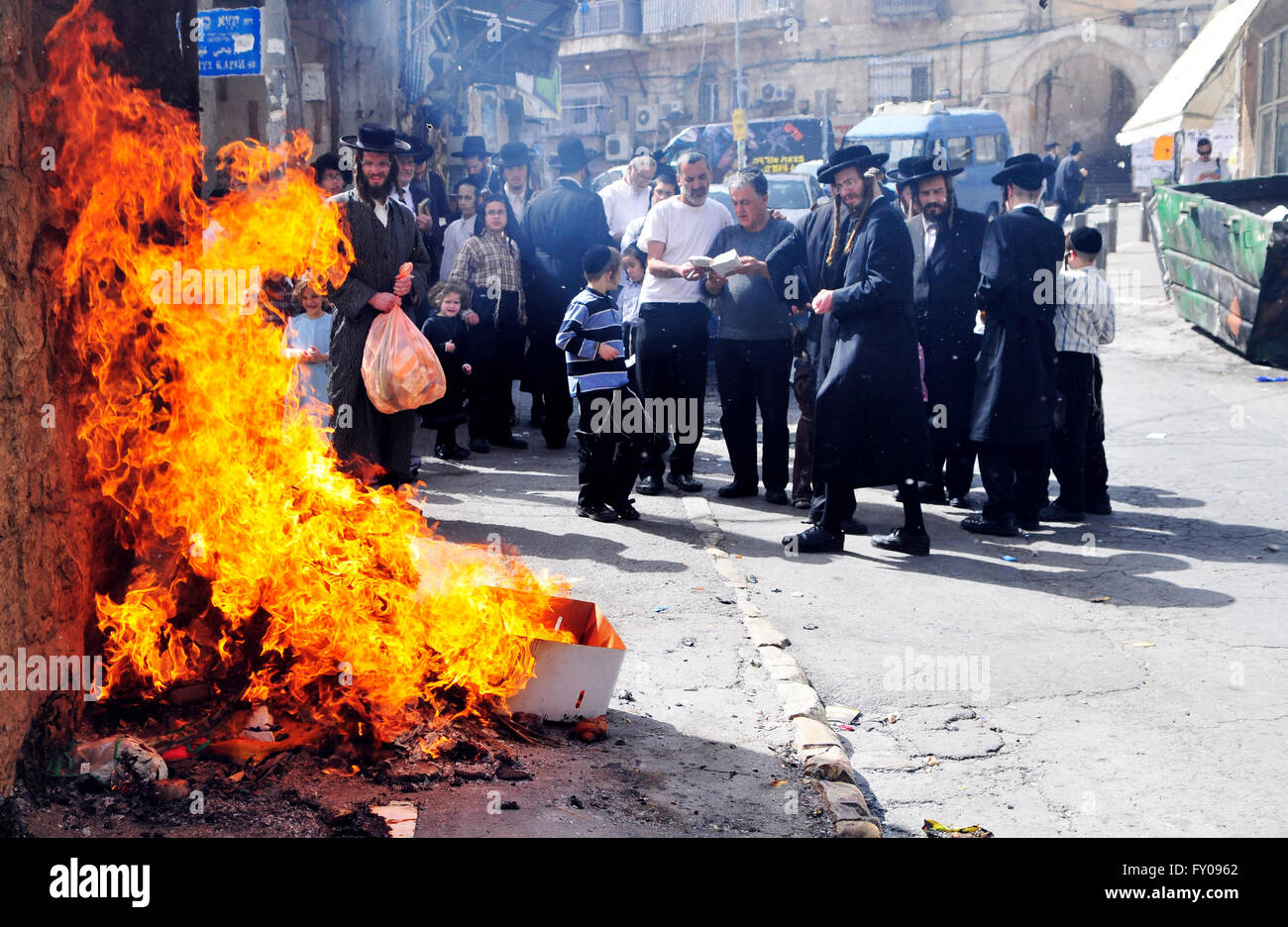 Orthodox ( Hasidic ) boys and men burn the Chametz (leavened foods that