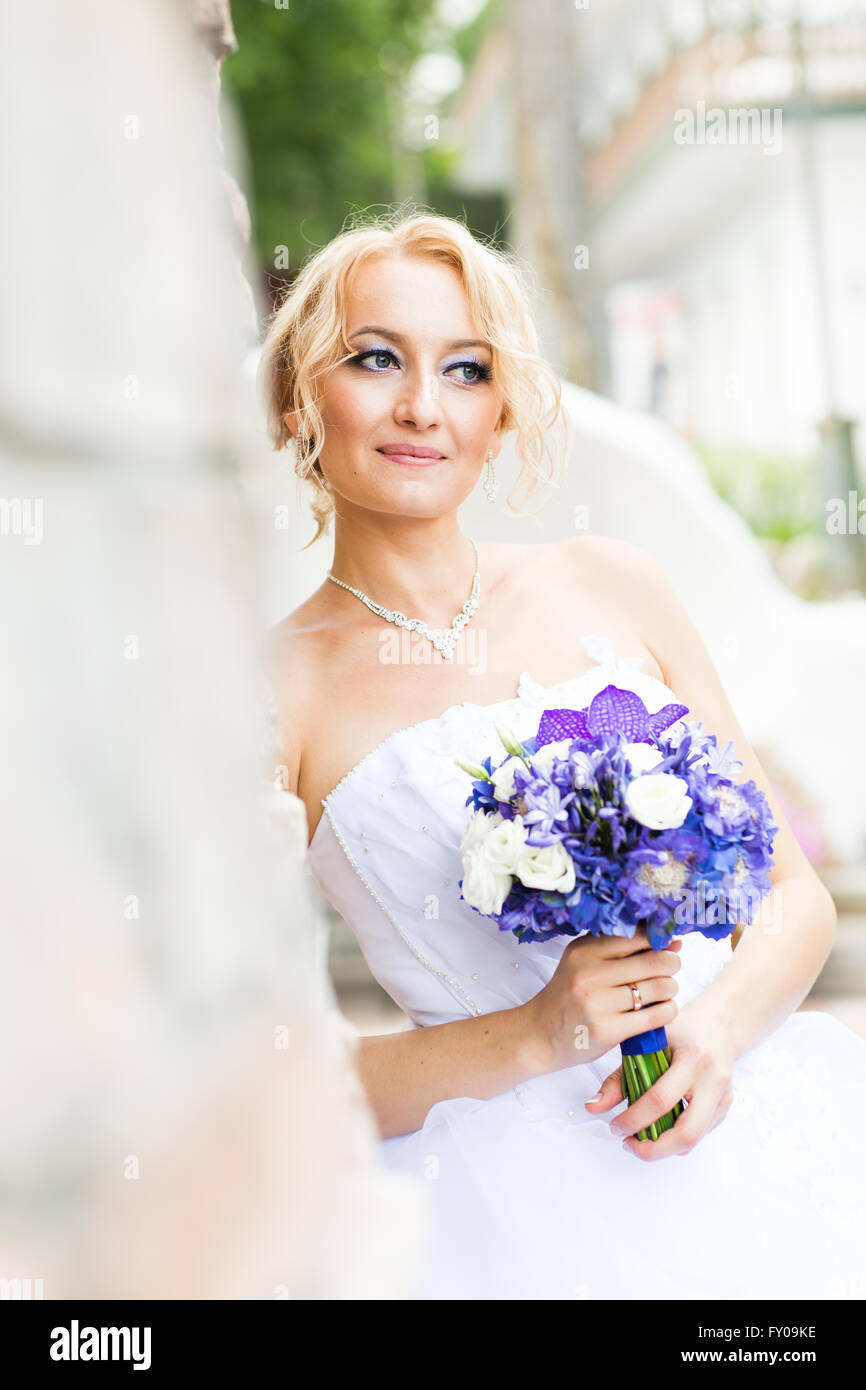 Beautiful wedding bouquet in hands of the bride Stock Photo - Alamy