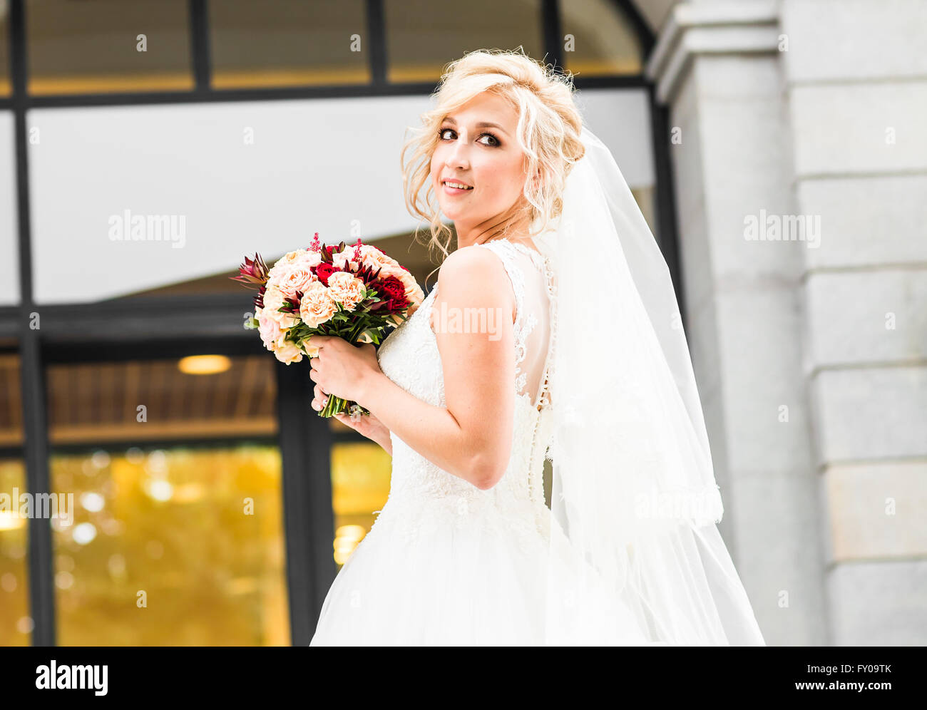 Beautiful wedding bouquet in hands of the bride Stock Photo - Alamy
