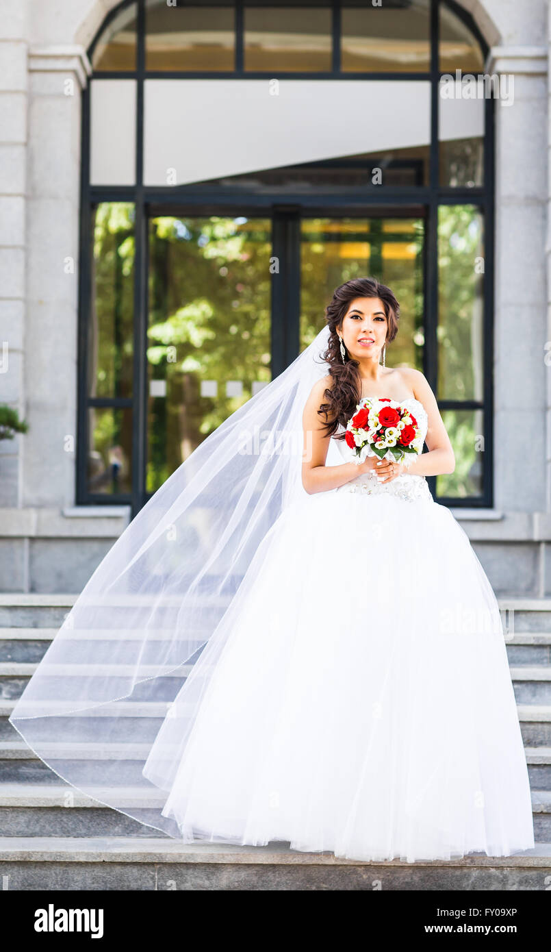Beautiful wedding bouquet in hands of the bride Stock Photo - Alamy
