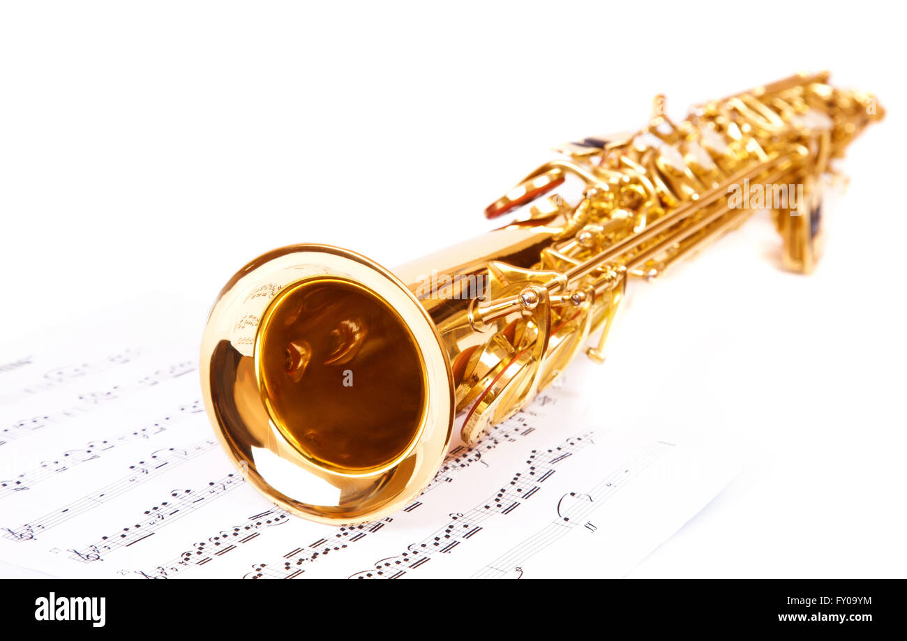 Musical notes and saxophone, isolated on white Stock Photo