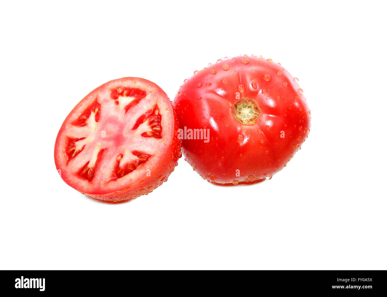 Tomatoes with water drops on white background Stock Photo - Alamy