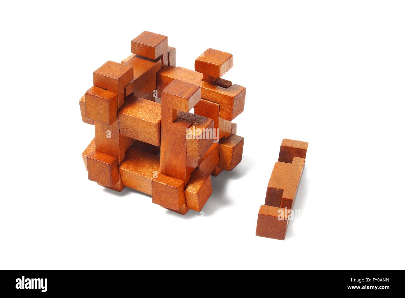 Classic wooden puzzle isolated on white background Stock Photo - Alamy