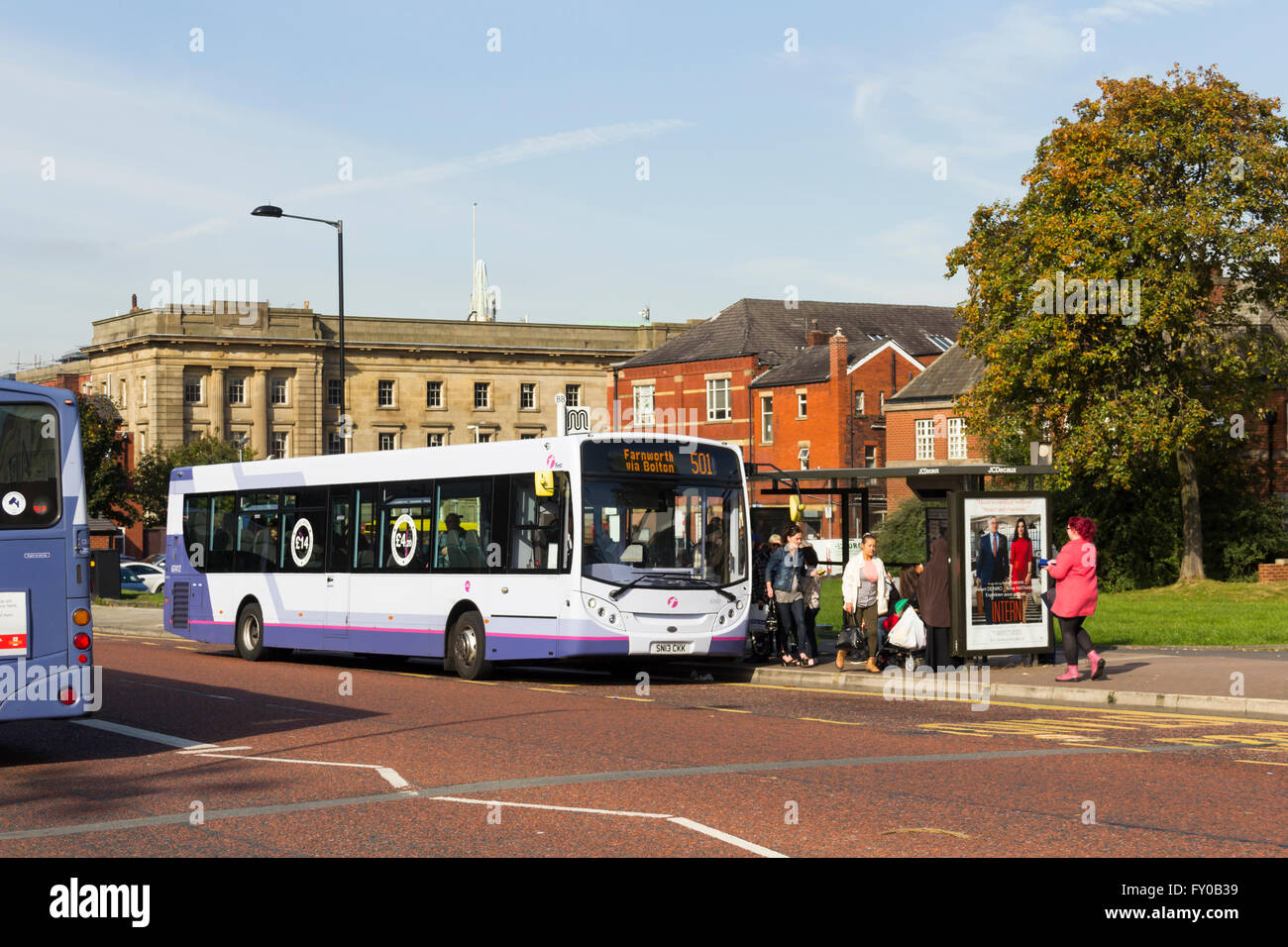 Passengers disembark from the 501 service at stop BB on Black Horse Street, Bolton, adjacent to Moor Lane bus station. This stop Stock Photo