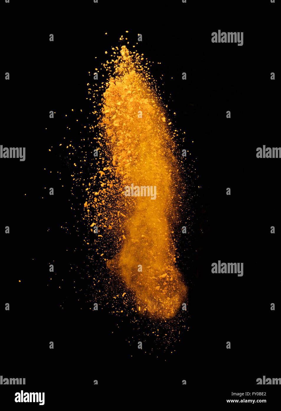 Explosion of yellow powder on black background Stock Photo Alamy