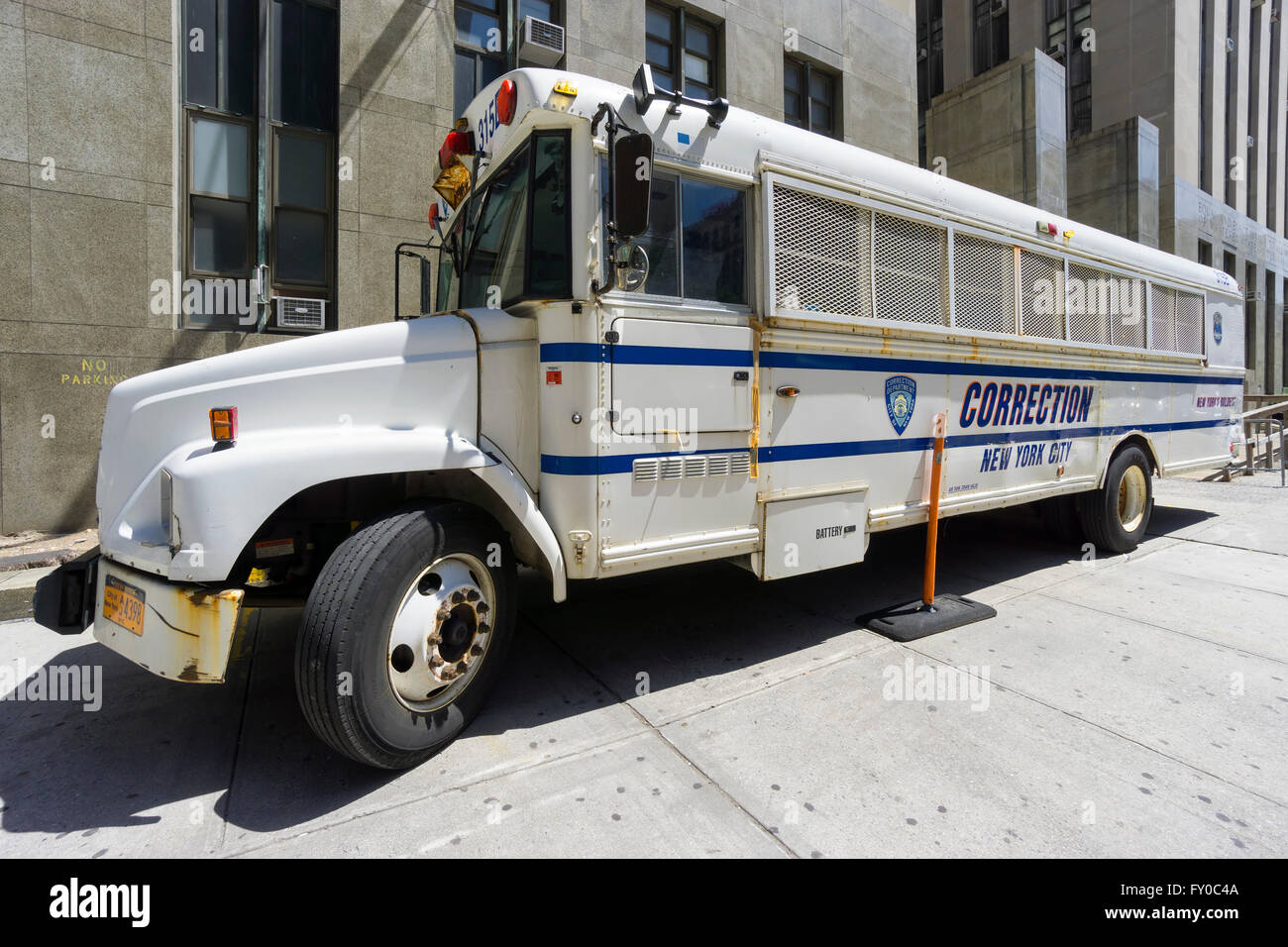 NEW YORK CITY- JUNE 13, 2015: Correction Department bus parked in front of New York City Criminal Court Stock Photo
