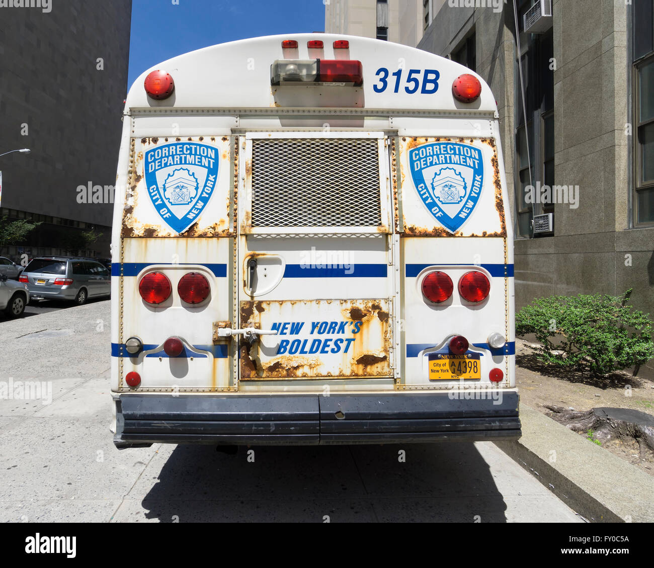 NEW YORK CITY- JUNE 13, 2015: Correction Department bus parked in front of New York City Criminal Court Stock Photo