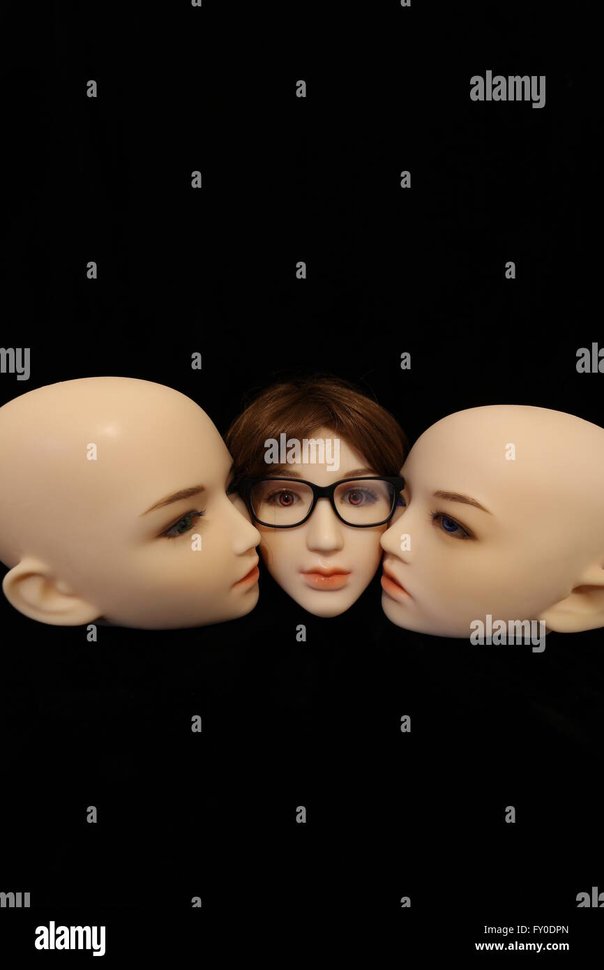 Silicone heads on black background Stock Photo