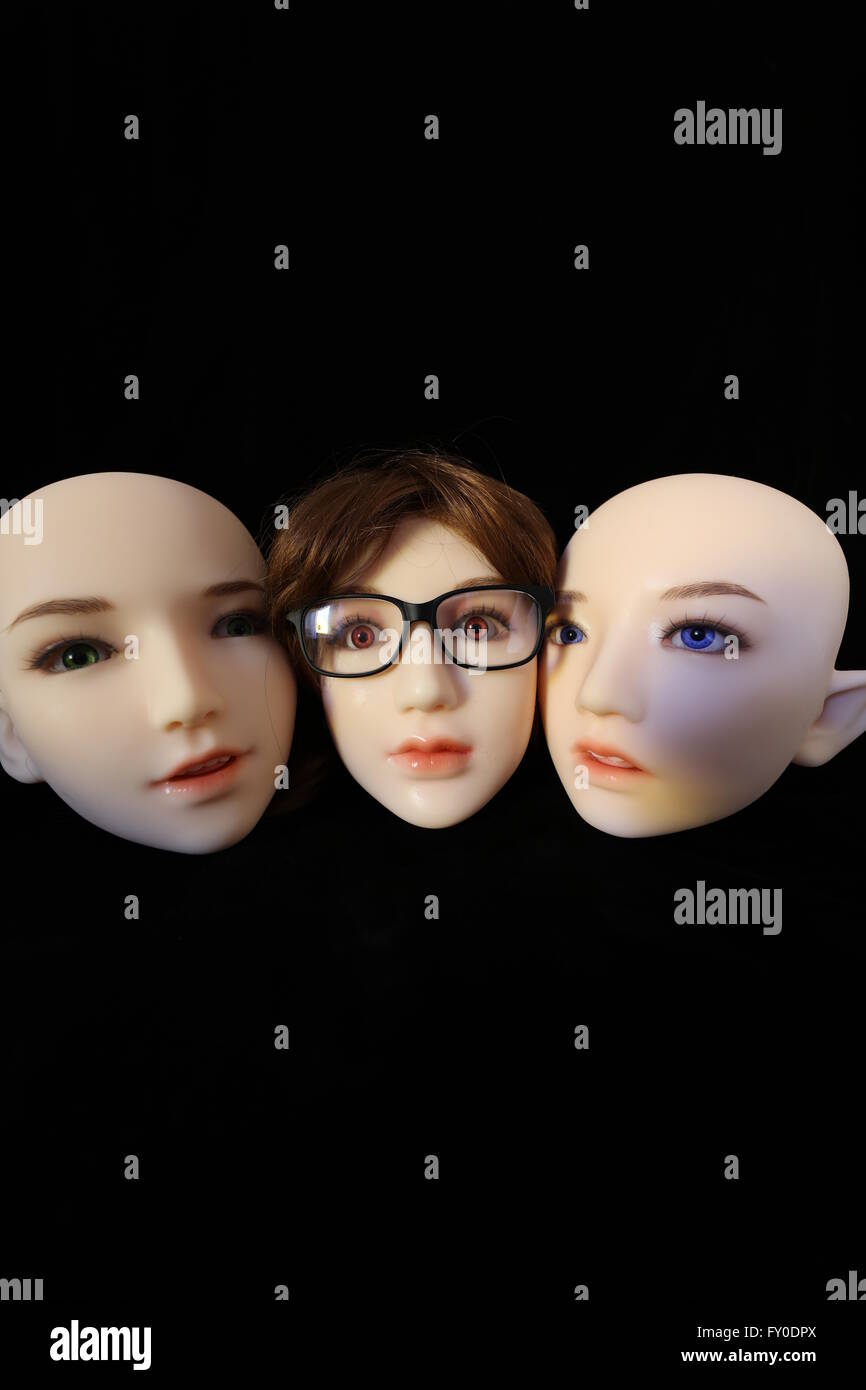 Silicone heads on black background Stock Photo