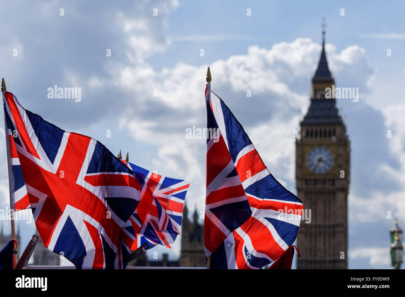 Big Ben at the Palace of Westminster with Union Jack flags, London England United Kingdom UK Stock Photo