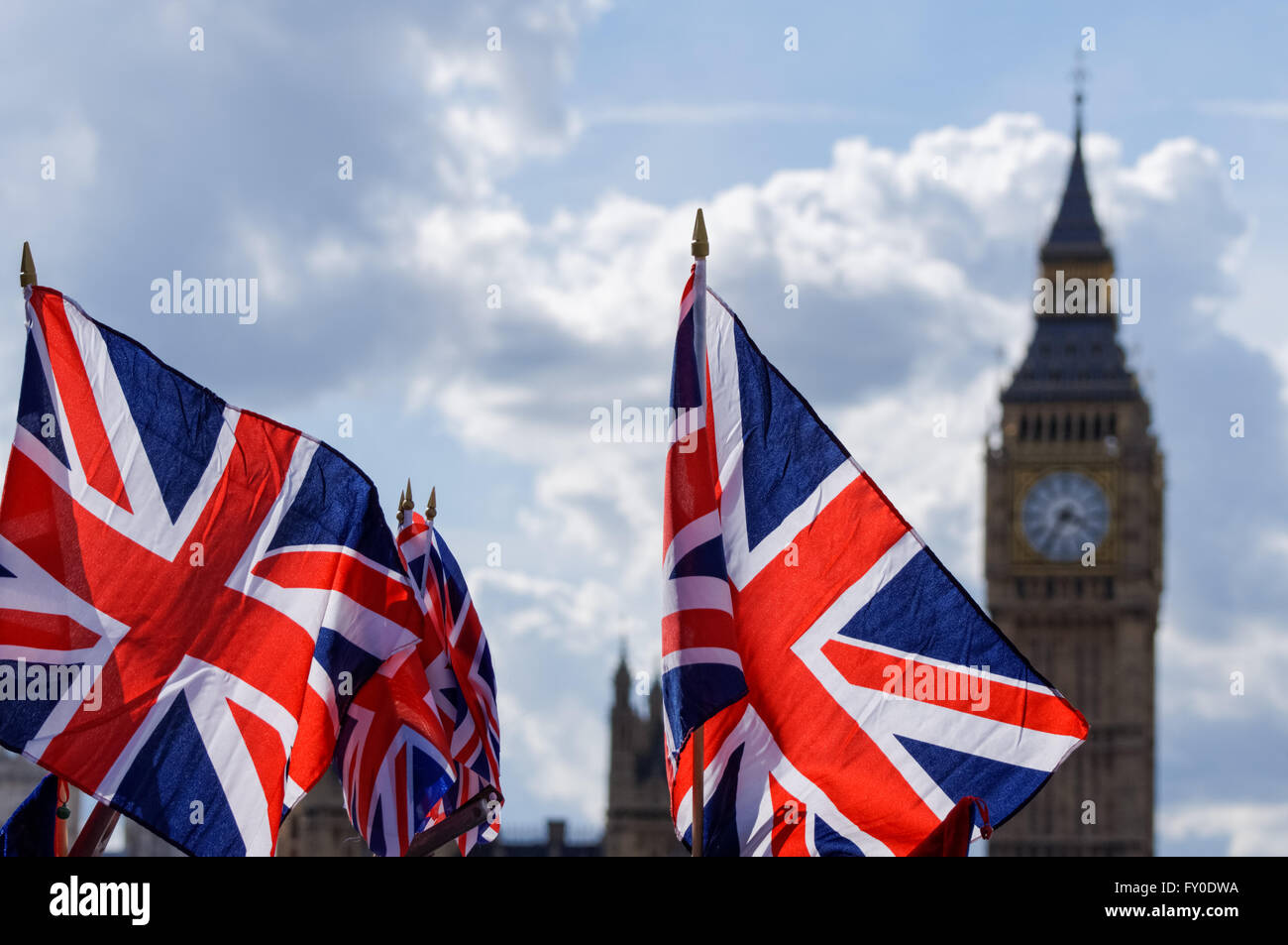 Big Ben at the Palace of Westminster with Union Jack flags, London England United Kingdom UK Stock Photo