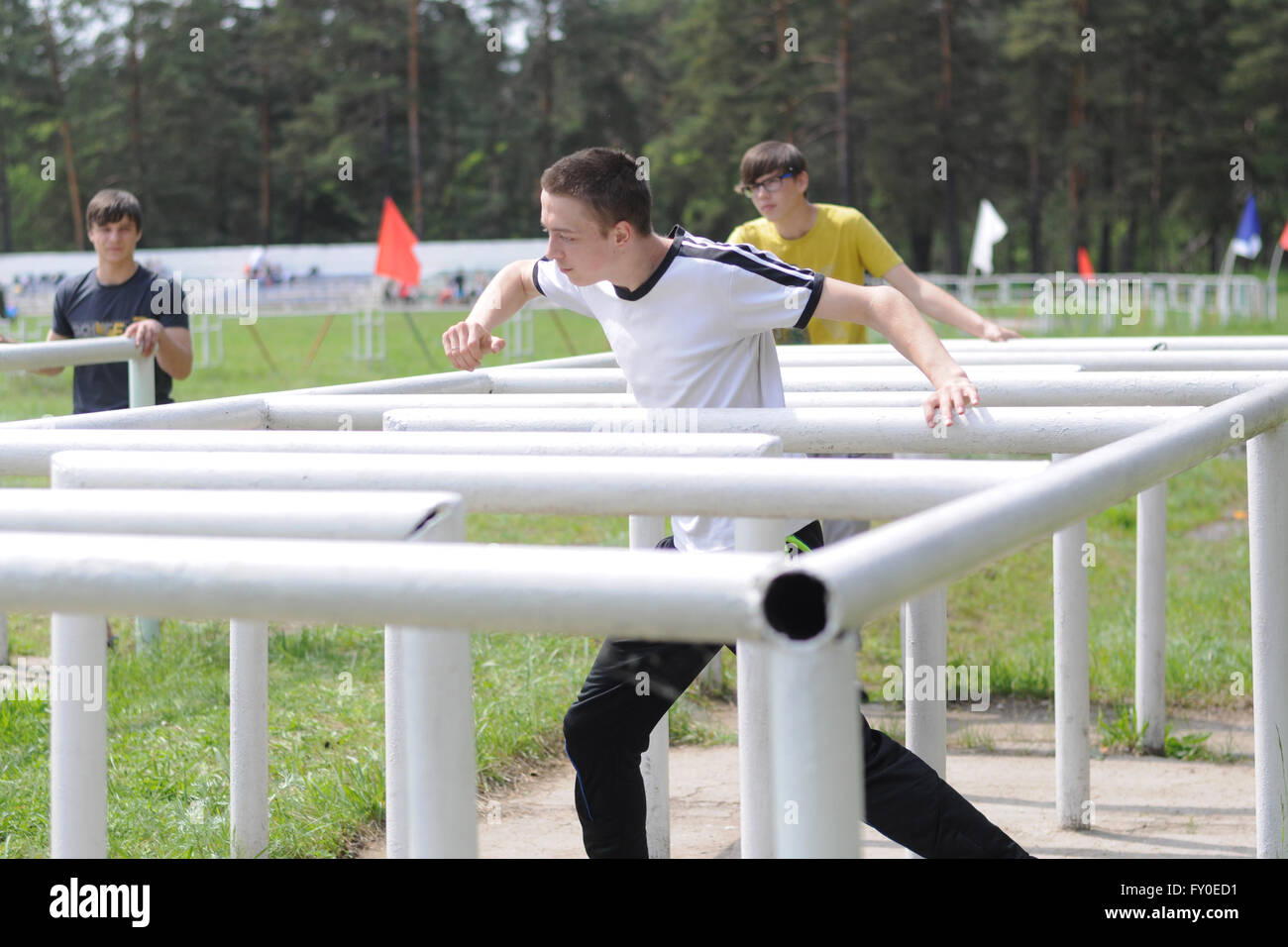 Military sports game Zarnitsa. Participants of the game to overcome the maze obstacle course Stock Photo