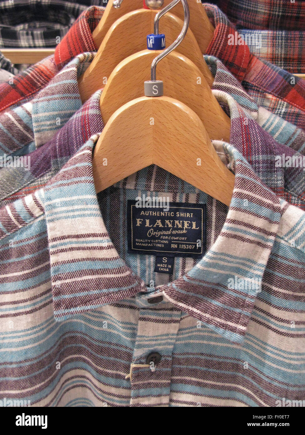 flannel shirts for sale on hangar Stock Photo