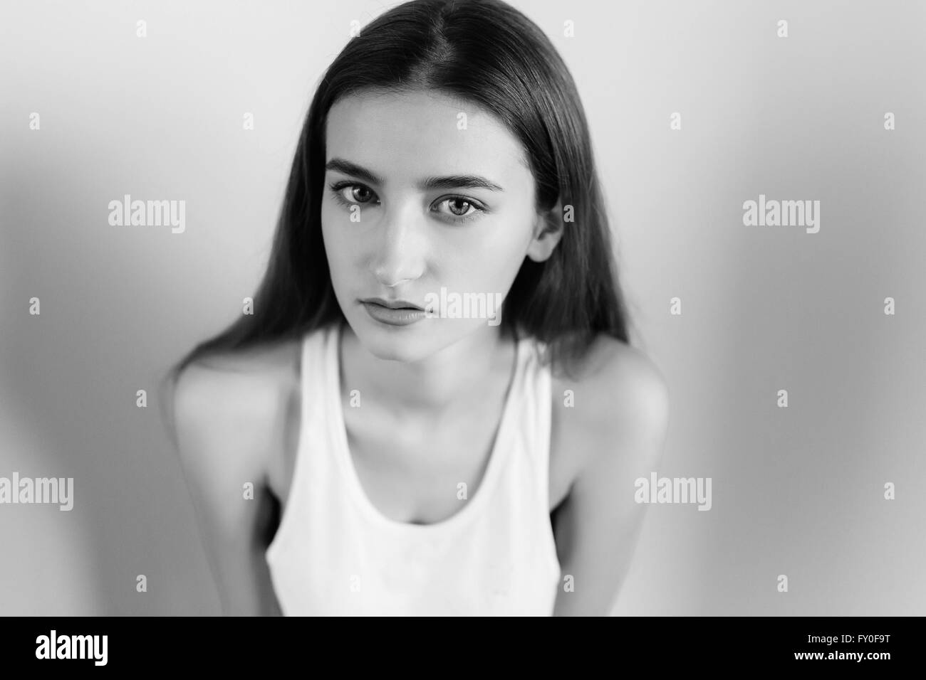young beautiful girl posing on a white background Stock Photo - Alamy
