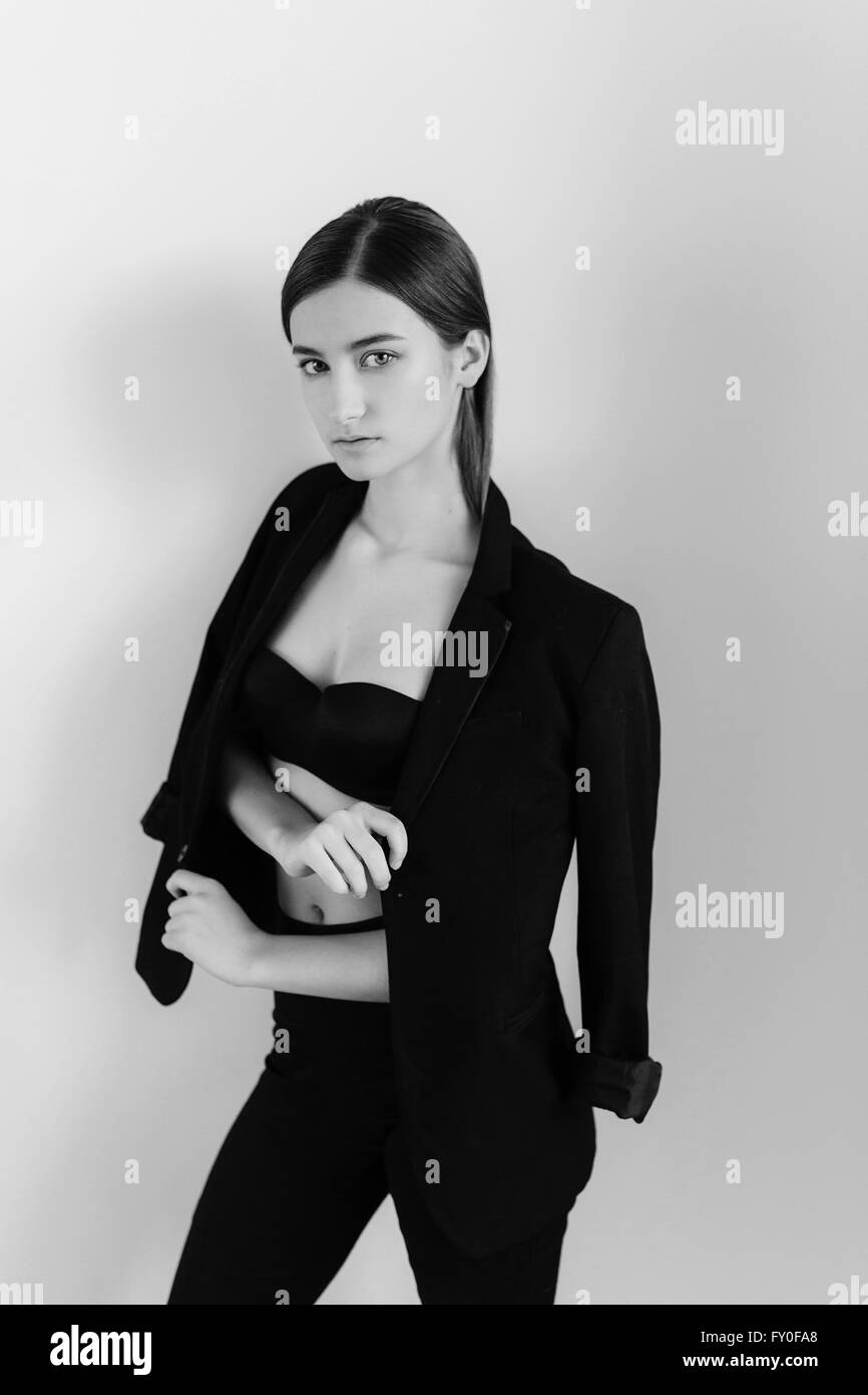 young beautiful girl posing on a white background Stock Photo - Alamy