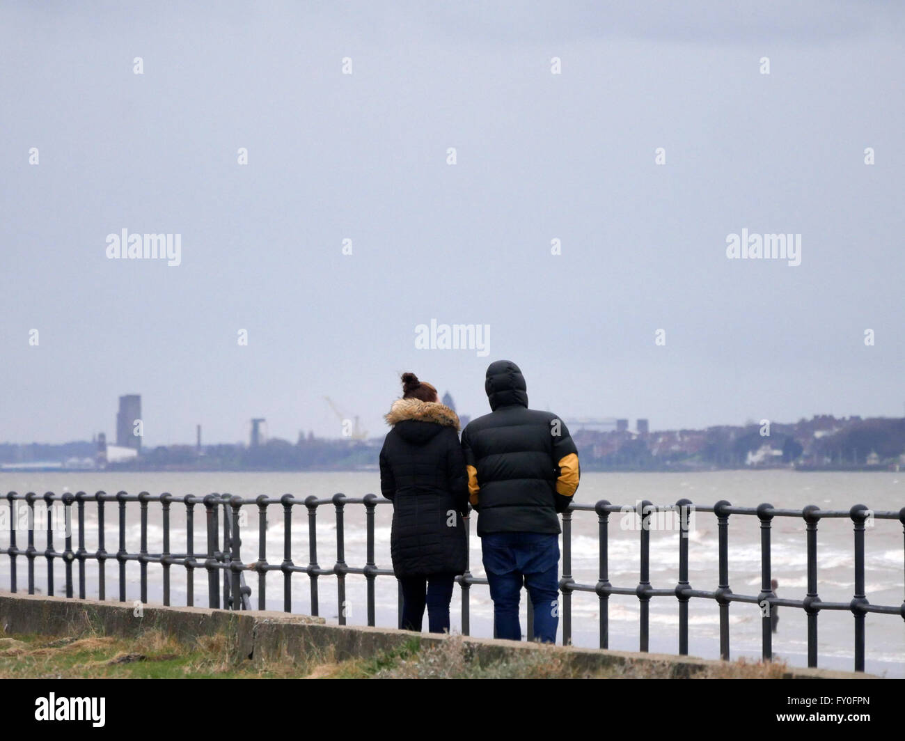 People enjoying a walk on Crosby Promenade in Winter Stock Photo