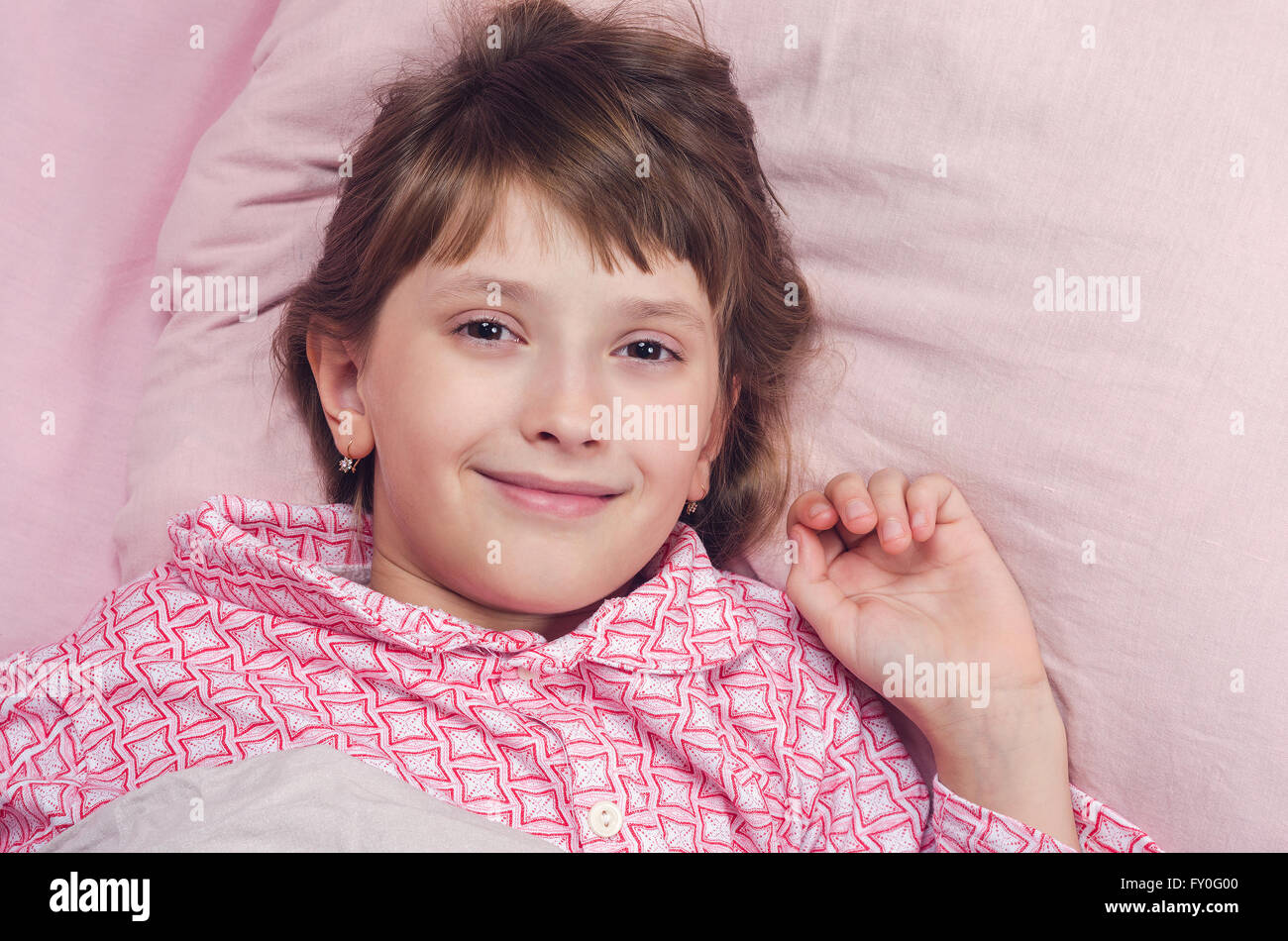 The girl goes to bed in a bed Stock Photo Alamy