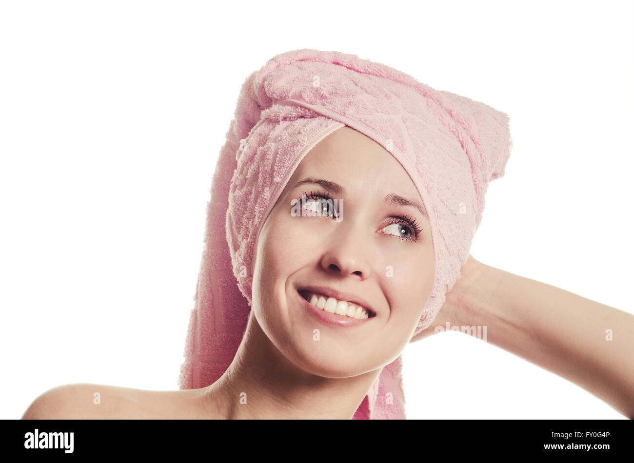 The woman with a towel on the head smiles with teeth Stock Photo Alamy