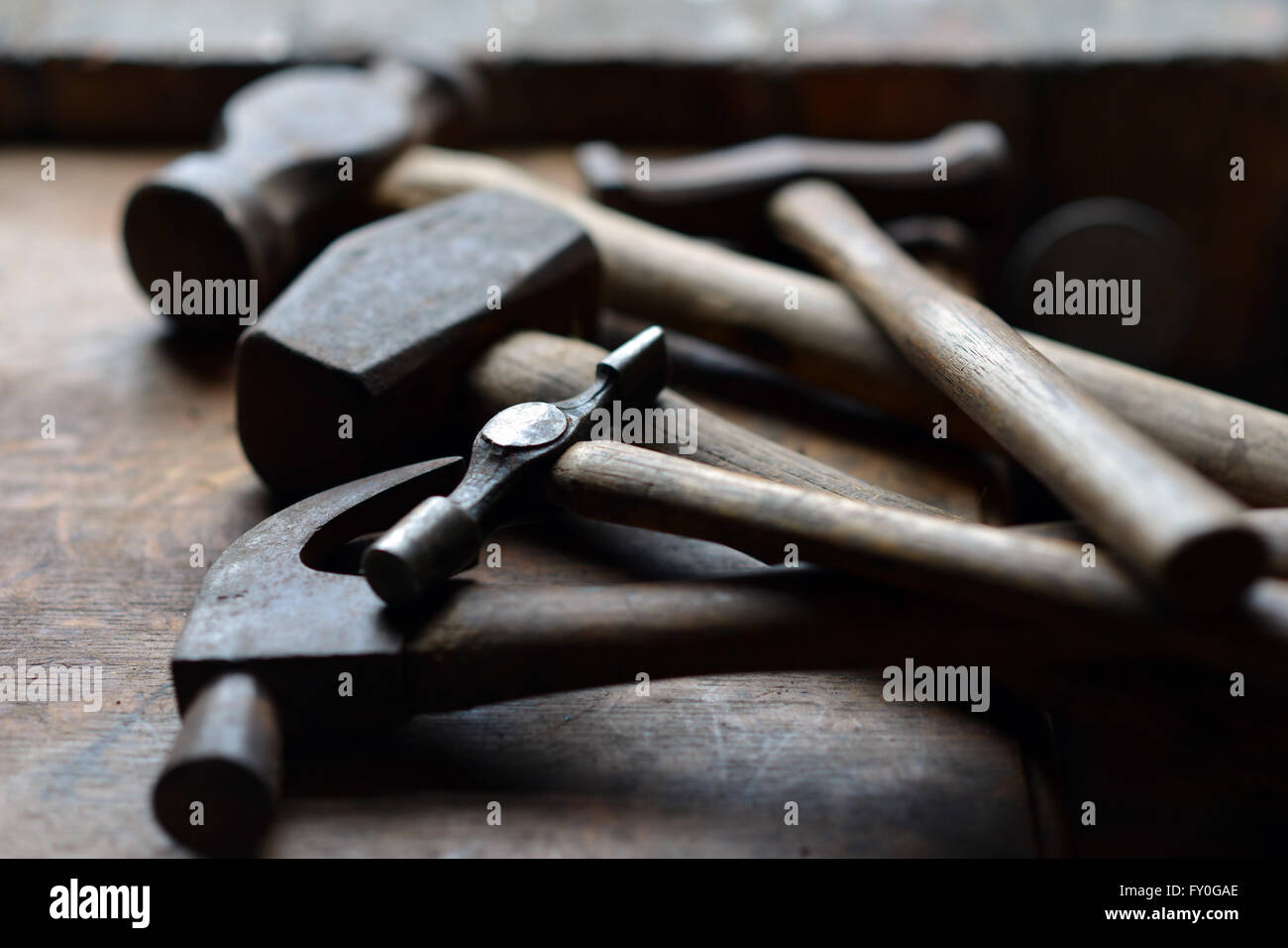 Pile of vintage hammers in shed Stock Photo