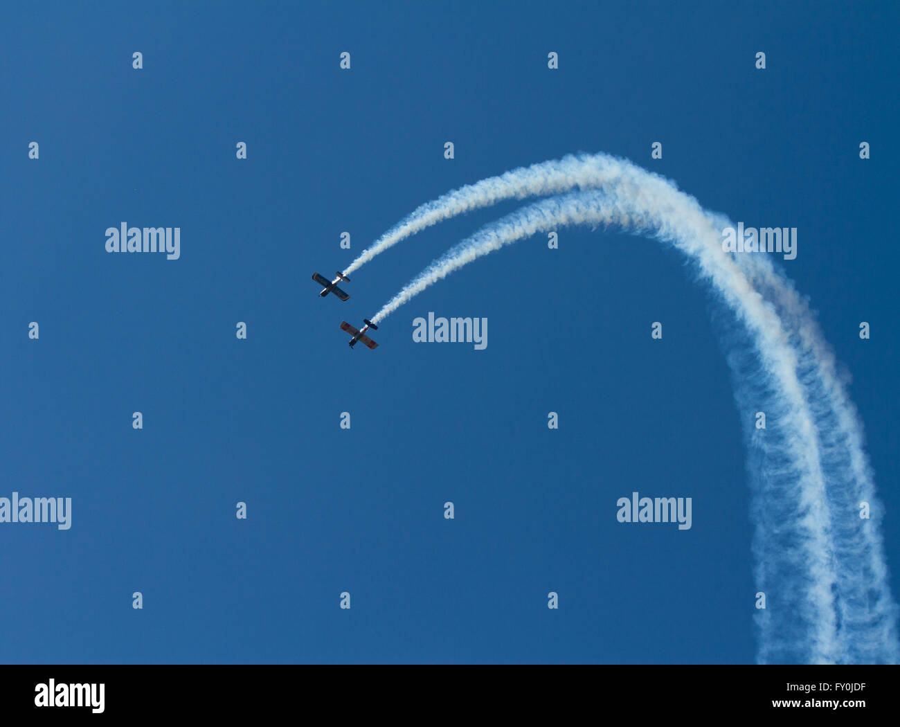 Airshow with planes smoke and blue sky Stock Photo Alamy