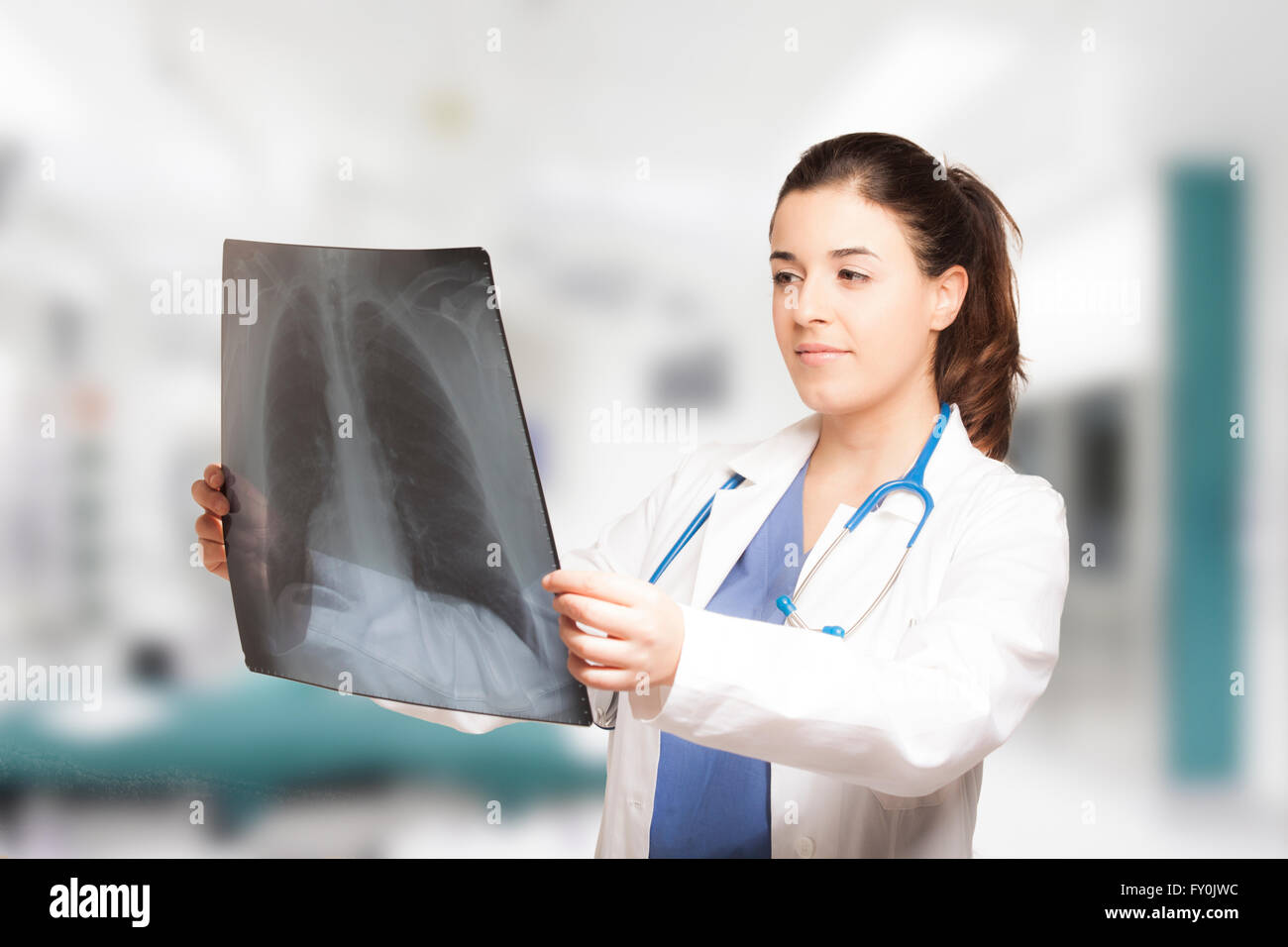 Caucasian young female doctor looking at a radiography Stock Photo